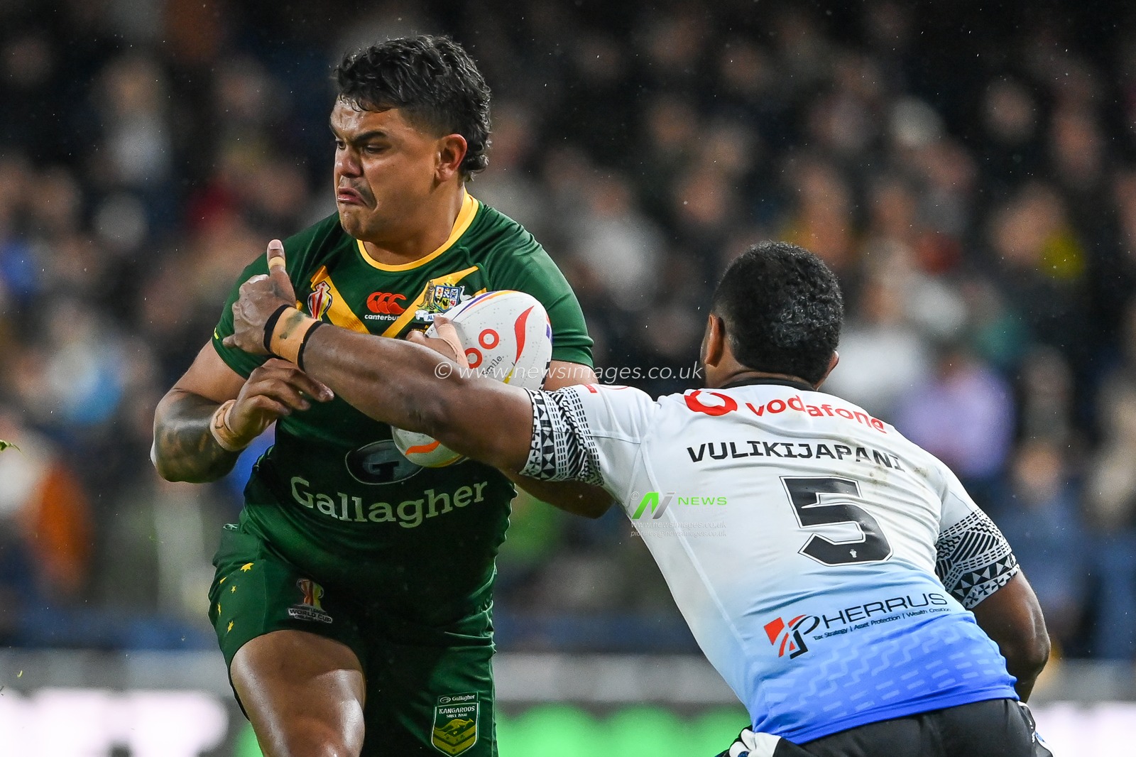 Latrell Mitchell of Australia is tackled by Mitieli Vulikijapani of Fiji during the Rugby League World Cup 2021 match Australia vs Fiji at Headingley Stadium, Leeds, United Kingdom, 15th October 2022

(Photo by Craig Thomas/News Images)