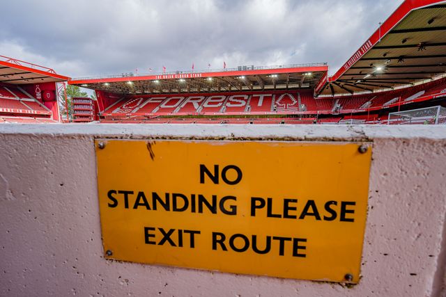 A general view of the pitch and stands and the no standing sign  during the Premier League match Nottingham Forest vs Aston Villa at City Ground, Nottingham, United Kingdom on 12 April 2026

(Photo by Maynard Manyowa/News Images)