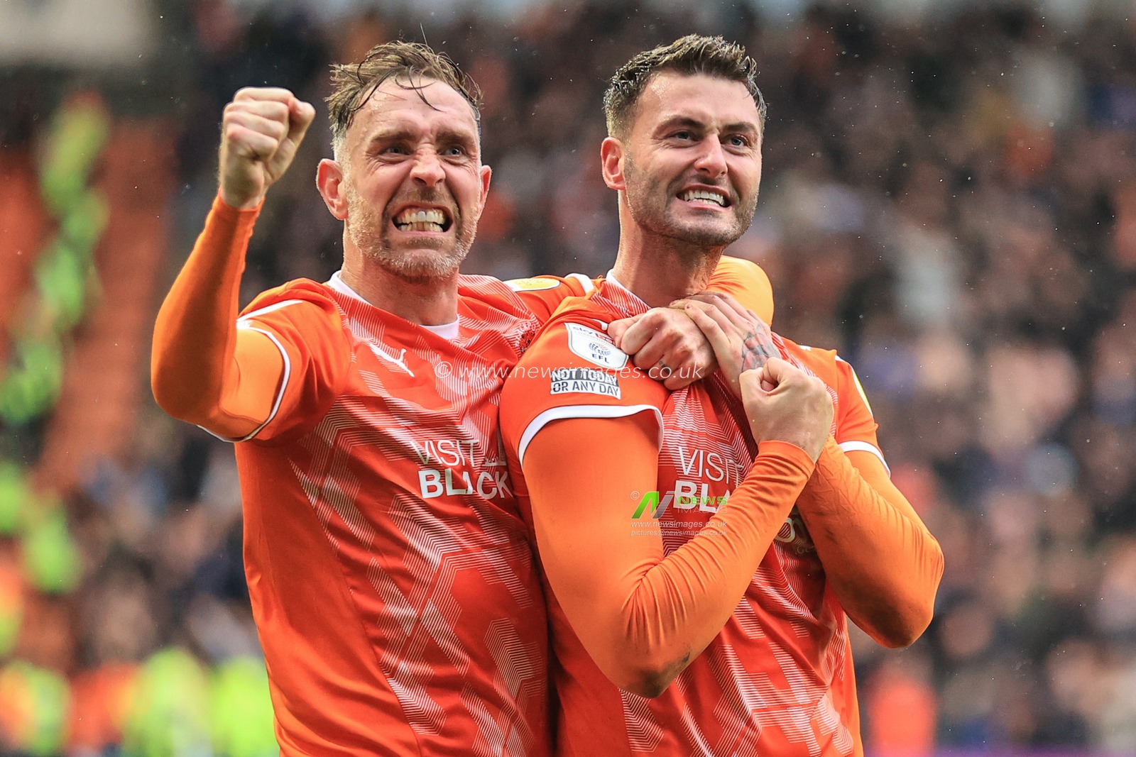 Gary Madine #14 of Blackpool |celebrates his goal to make it 2-0 with Richard Keogh #26 of Blackpool