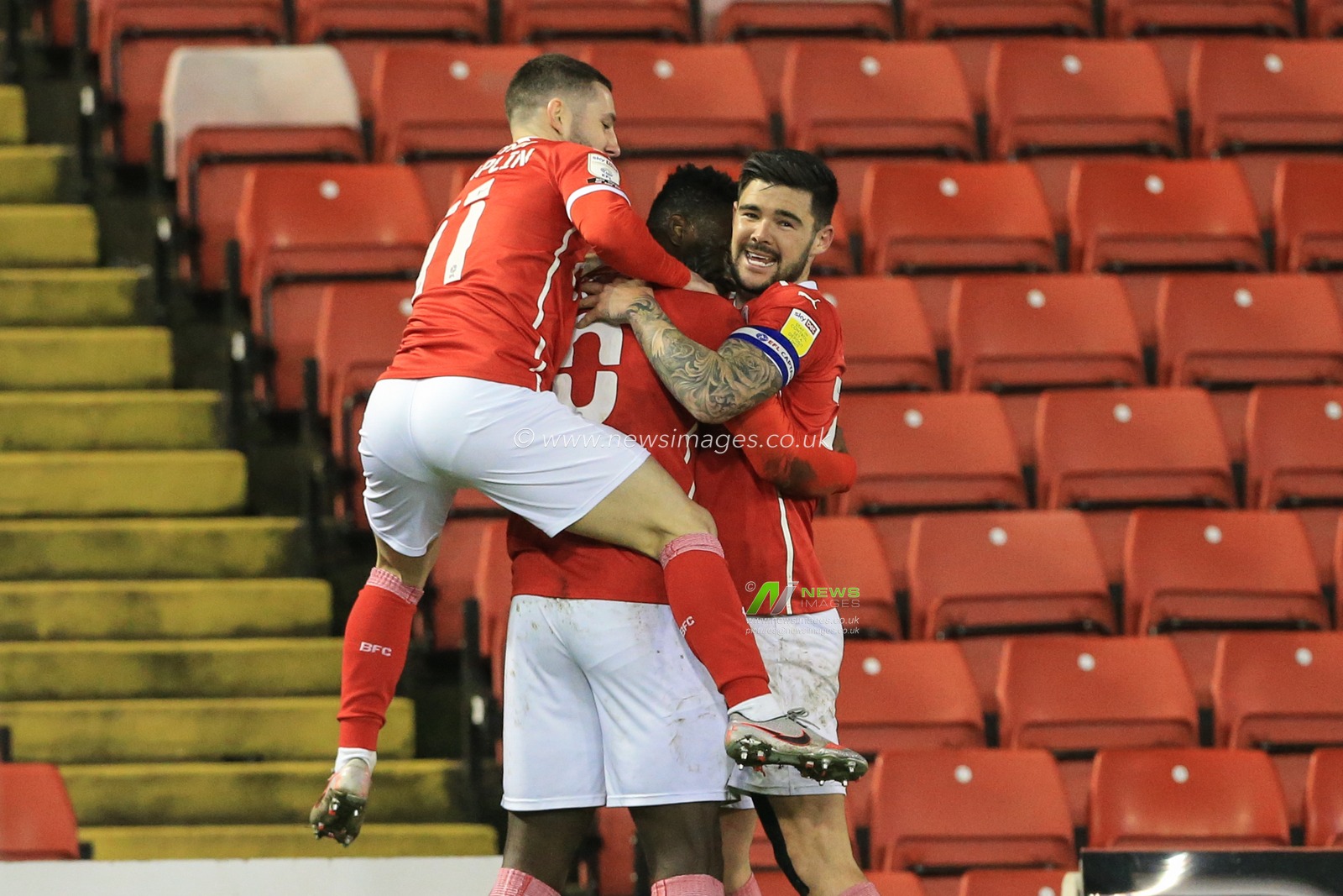 Daryl Dike #10 of Barnsley celebrates his goal to make it 2-0 with Alex Mowatt #27 of Barnsley and Conor Chaplin #11 of Barnsley