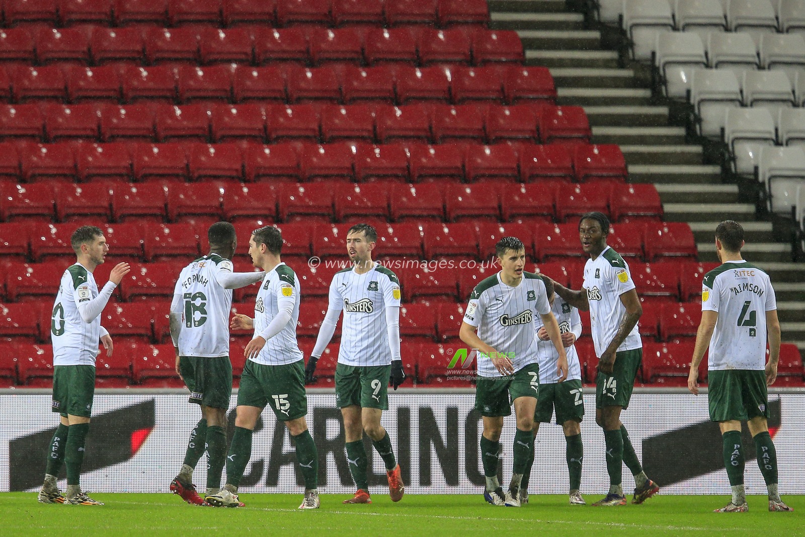 Adam Lewis #22 of Plymouth Argyle celebrates his goal with his teammates to make it 0-1
