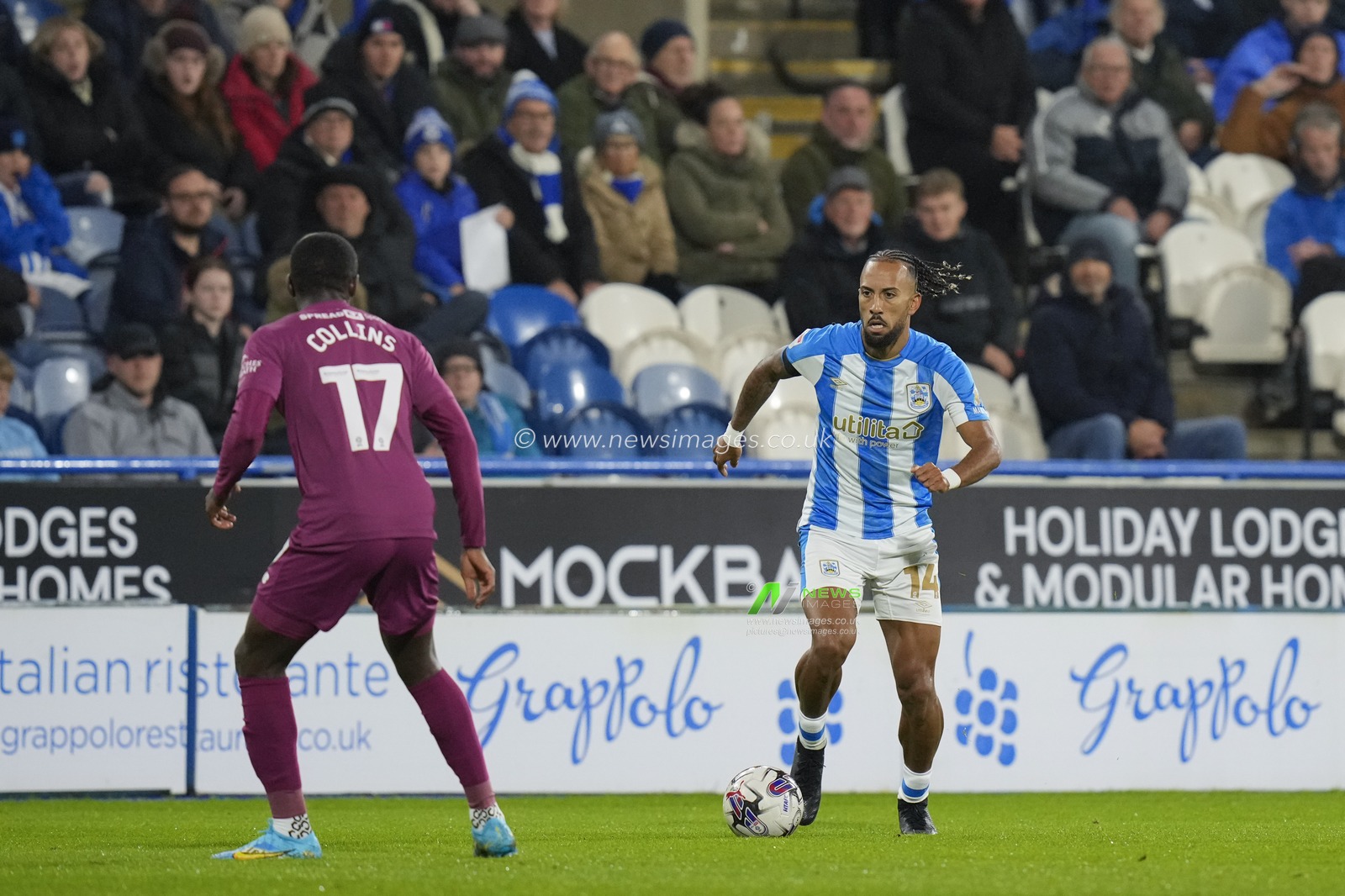 Sorba Thomas #14 of Huddersfield Town runs at Jamilu Collins #17 of Cardiff City during the Sky Bet Championship match Huddersfield Town vs Cardiff City at John Smith's Stadium, Huddersfield, United Kingdom, 24th October 2023

(Photo by Steve Flynn/News Images)