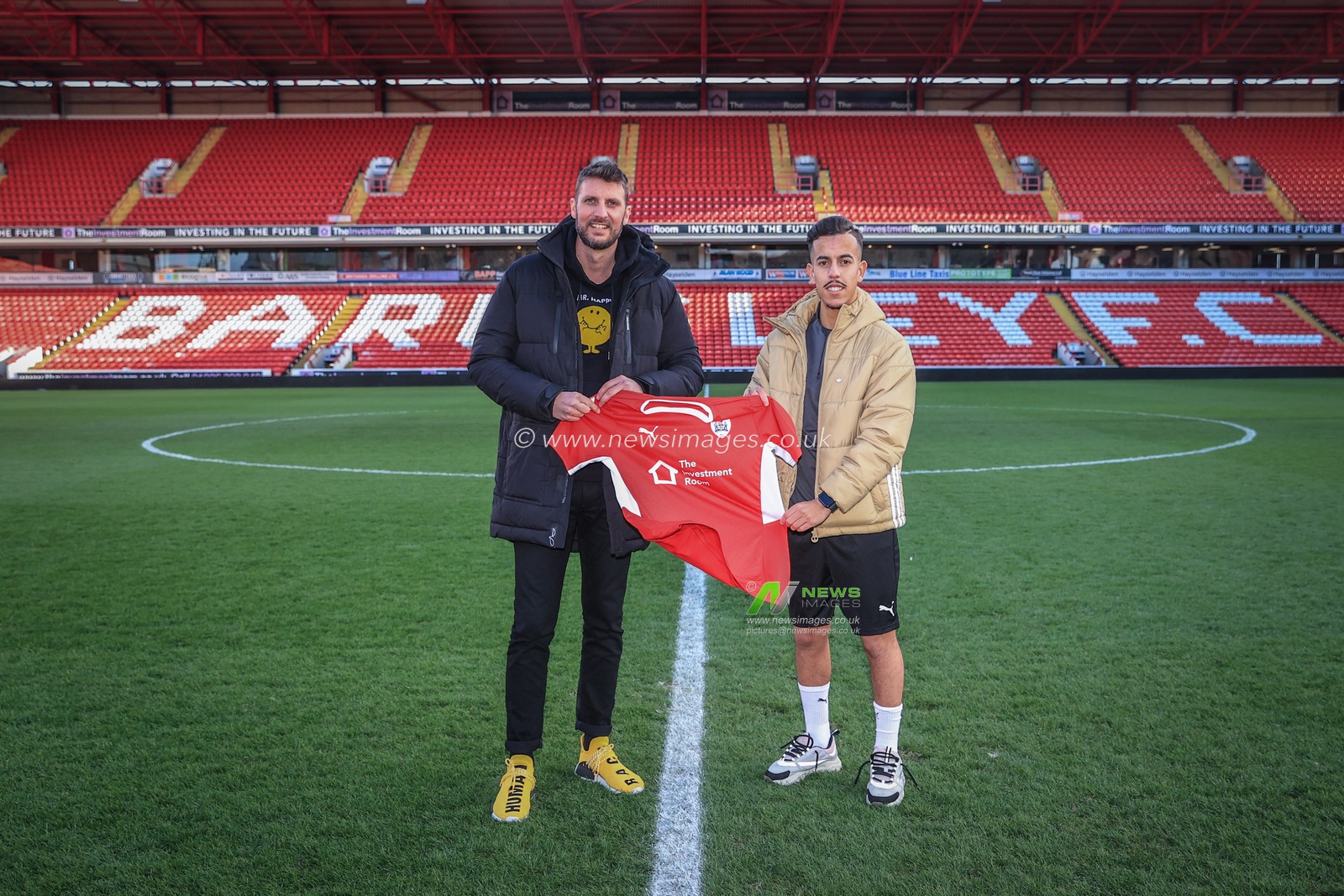 Amine Bassi and his agent SÃ©bastien Lesieur of Classico Sports Management on the pitch at Oakwell after Amine Bassi signs a rest of the season loan from FC Metz