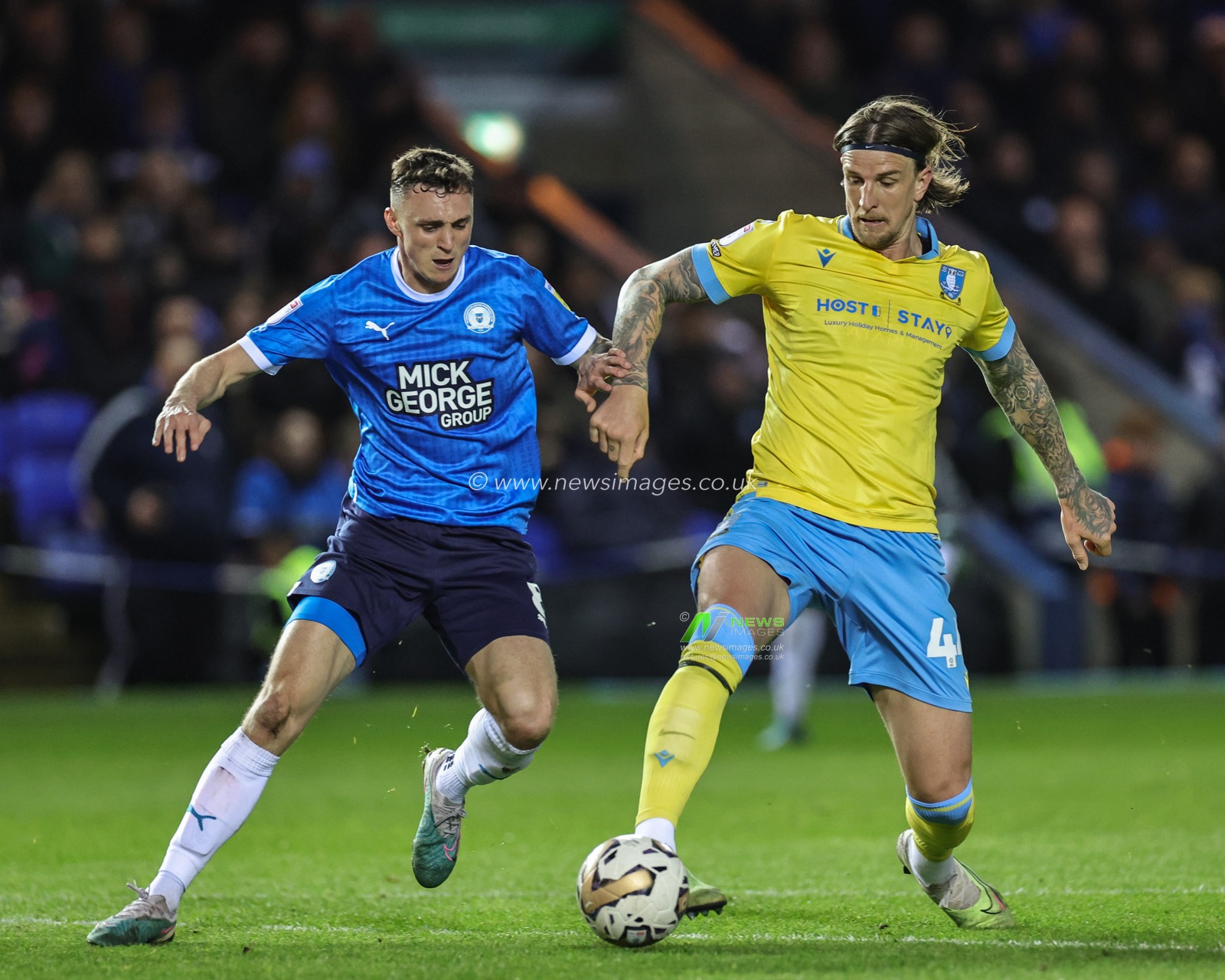 Aden Flint #44 of Sheffield Wednesday tackles Jack Taylor #8 of Peterborough United during the Sky Bet League 1 Play-Offs match Peterborough vs Sheffield Wednesday at Weston Homes Stadium, Peterborough, United Kingdom, 12th May 2023

(Photo by Mark Cosgrove/News Images)