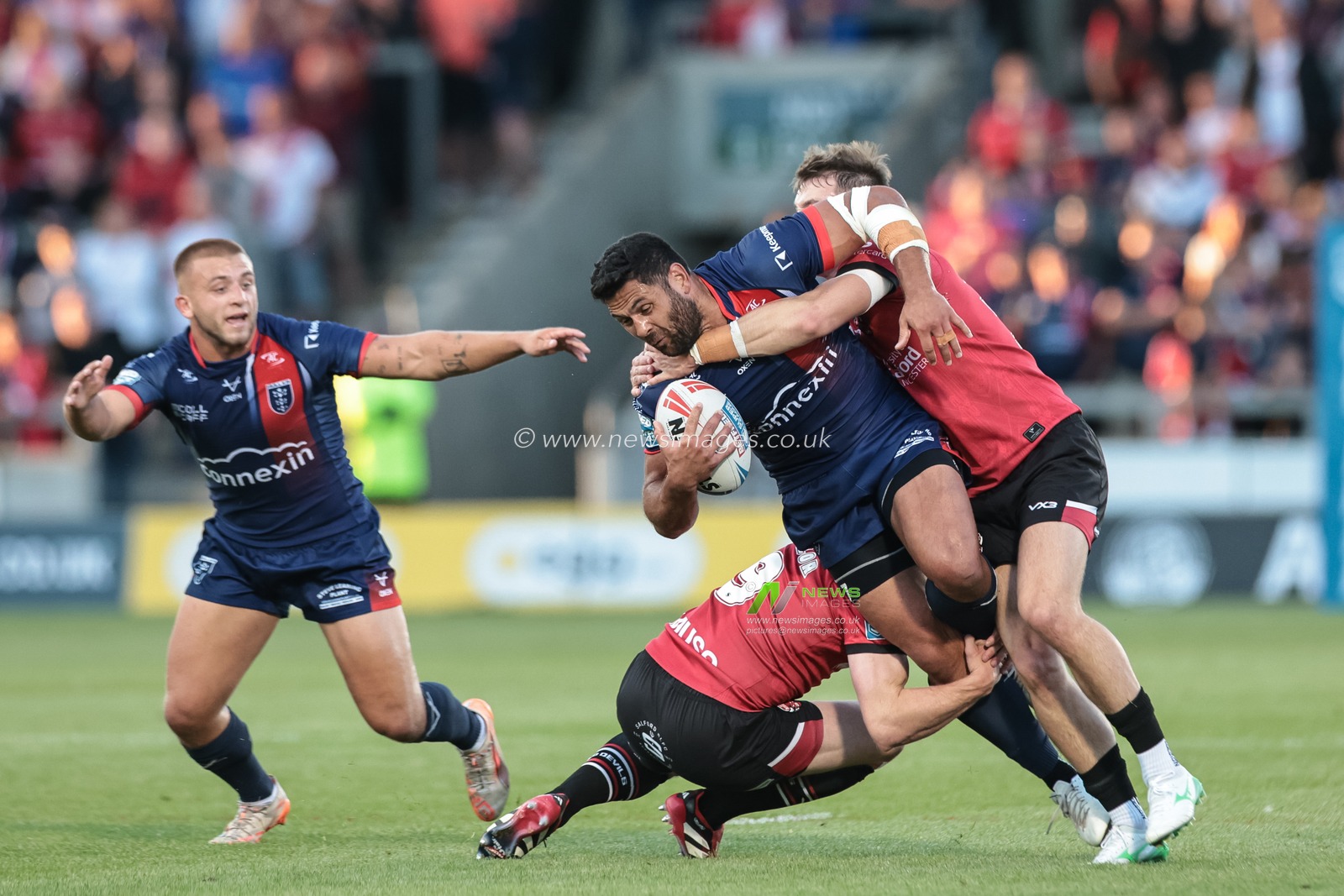 Rhyse Martin of Hull KR is tackled by Matty Foster of Salford Red Devils and Joe Mellor of Salford Red Devils during the Betfred Super League Round 20 Salford Red Devils vs Hull KR at Salford Community Stadium, Eccles, United Kingdom, 31st July 2025

(Photo by Mark Cosgrove/News Images)