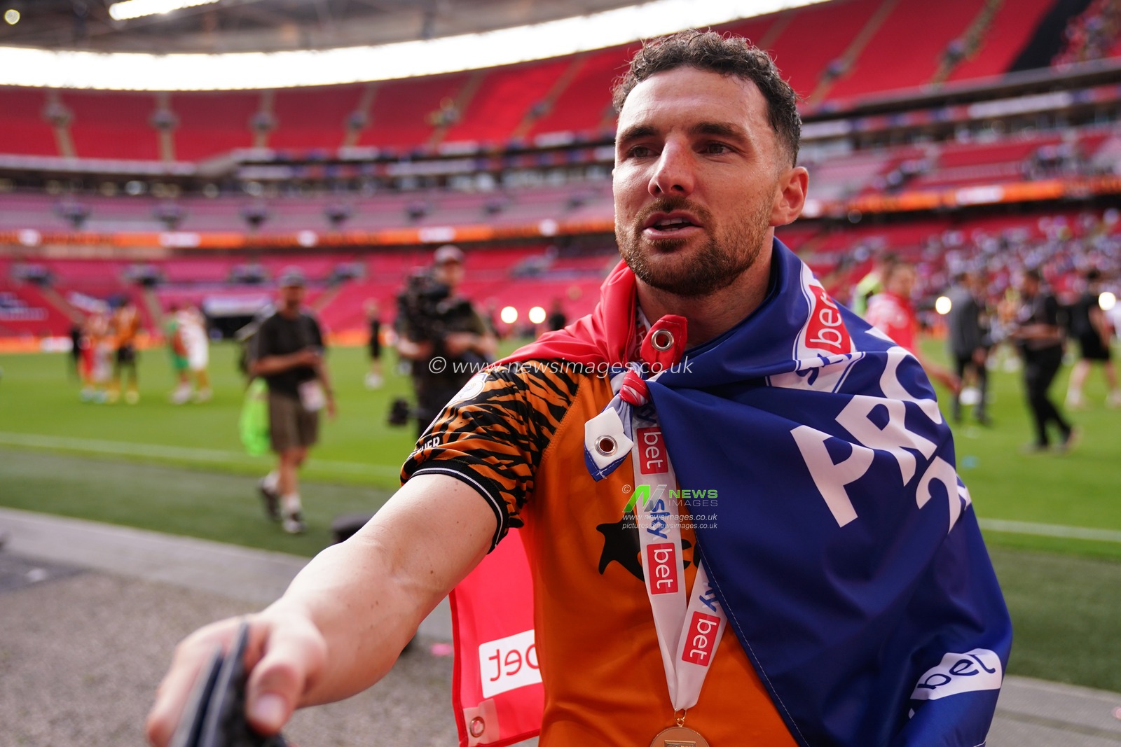 Lewis Coyle of Hull City gives away his shine pads to supporter during the Sky Bet Championship Playoffs Final match Hull City vs Middlesbrough at Wembley Stadium, London, United Kingdom on 23 May 2026

(Photo by Harvey Murphy/News Images)