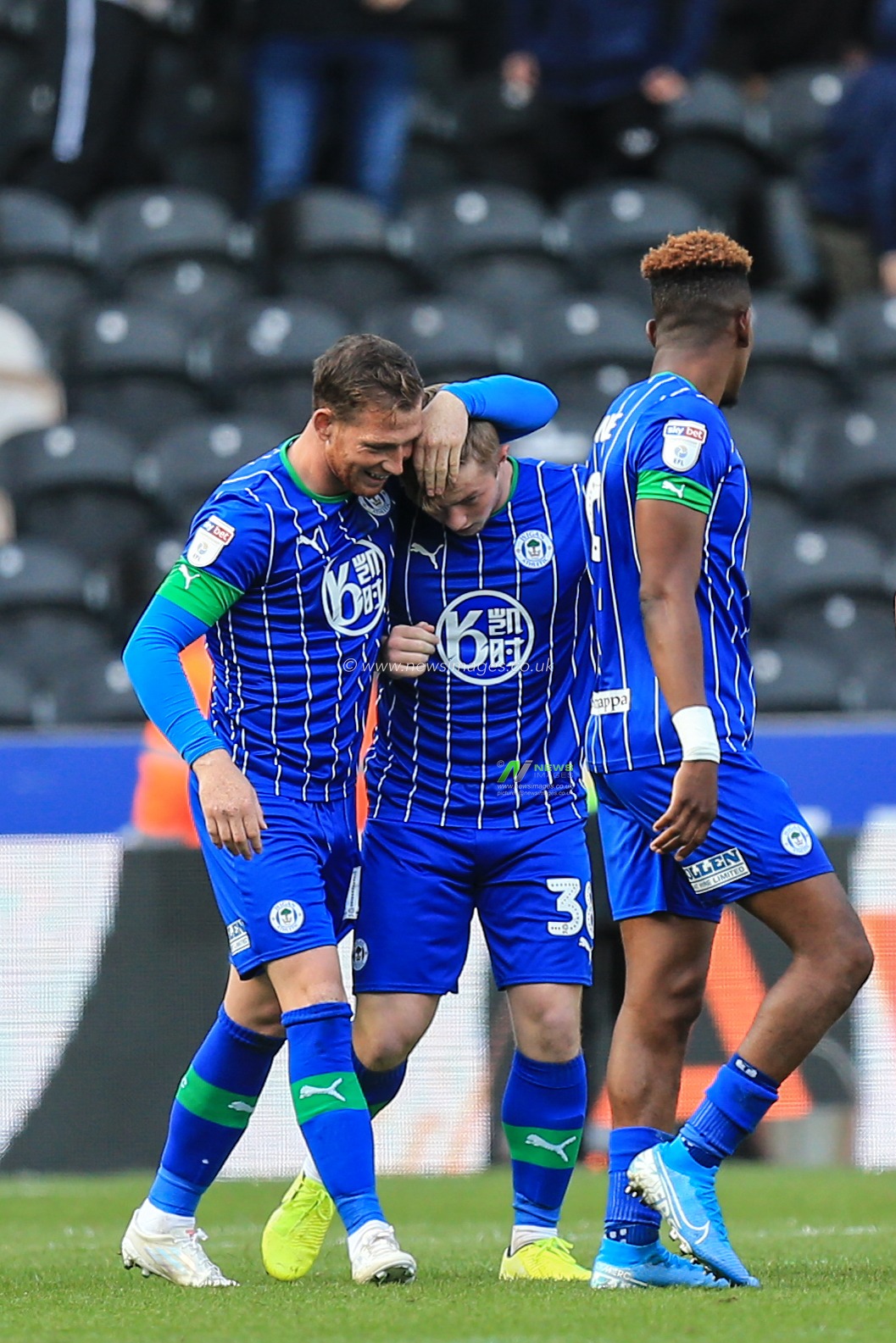 13th September 2019 , KCOM Stadium, Hull , England; Sky Bet Championship Football, Hull City vs Wigan Athletic ; 17 years old Joe Gelhardt (38) of Wigan Athletic is congratulated after scoring for Wigan 

Credit:   David Greaves/News Images

English Football League images are subject to DataCo Licence
