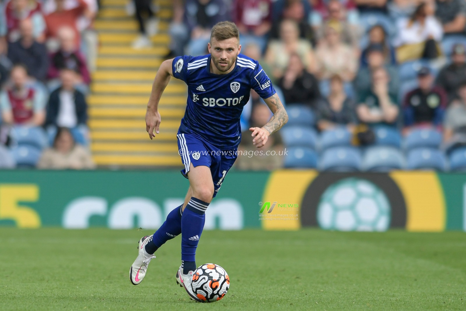 Stuart Dallas #15 of Leeds United runs forward with the ball