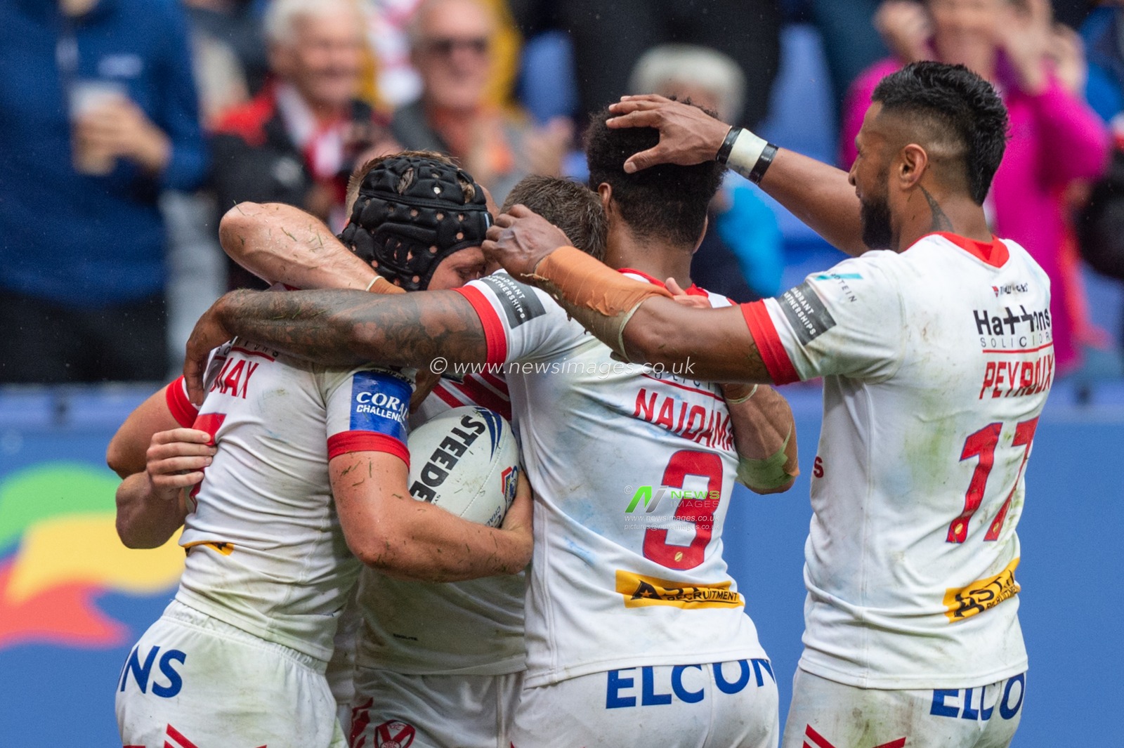 27th July 2019 , University of Bolton Stadium, Bolton, England; 2019 Coral Challenge Cup Semi-Final, St Helens vs Halifax RLFC ; Jonny Lomax of St Helens celebrates scoring his try with team mates

Credit: Richard Long/News Images
