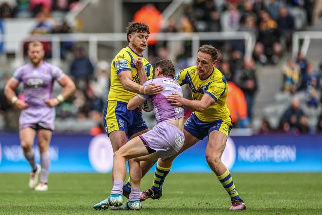 Jai Field of Wigan Warriors is tackled by Jordy Crowther of Warrington Wolves and Ben Currie of Warrington Wolves during the Betfred Magic Weekend 2025 match Wigan Warriors vs Warrington Wolves at St. James's Park, Newcastle, United Kingdom, 4th May 2025

(Photo by Mark Cosgrove/News Images)