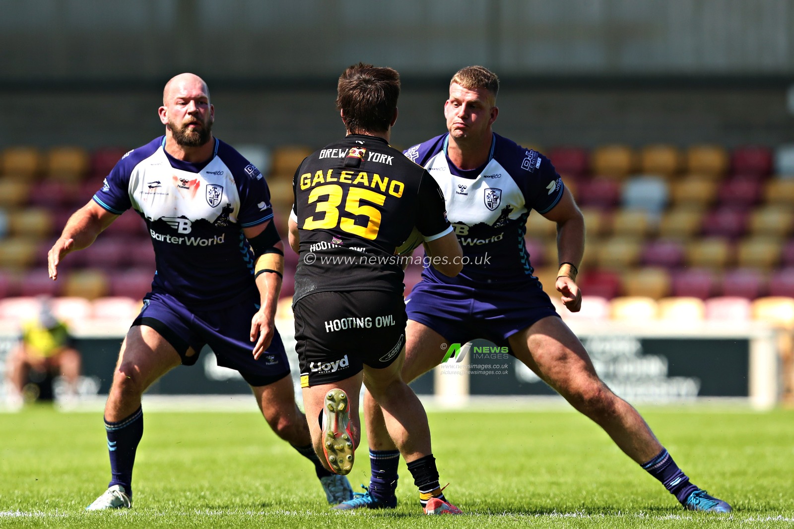 Brad Day of Featherstone Rovers and Jimmy Beckett of Featherstone Rovers tackle Scott Galeano of York Knights RLFC during the Betfred Championship match York City Knights vs Featherstone Rovers at LNER Community Stadium, York, United Kingdom, 29th June 2025(Photo by Sam Eaden/News Images)