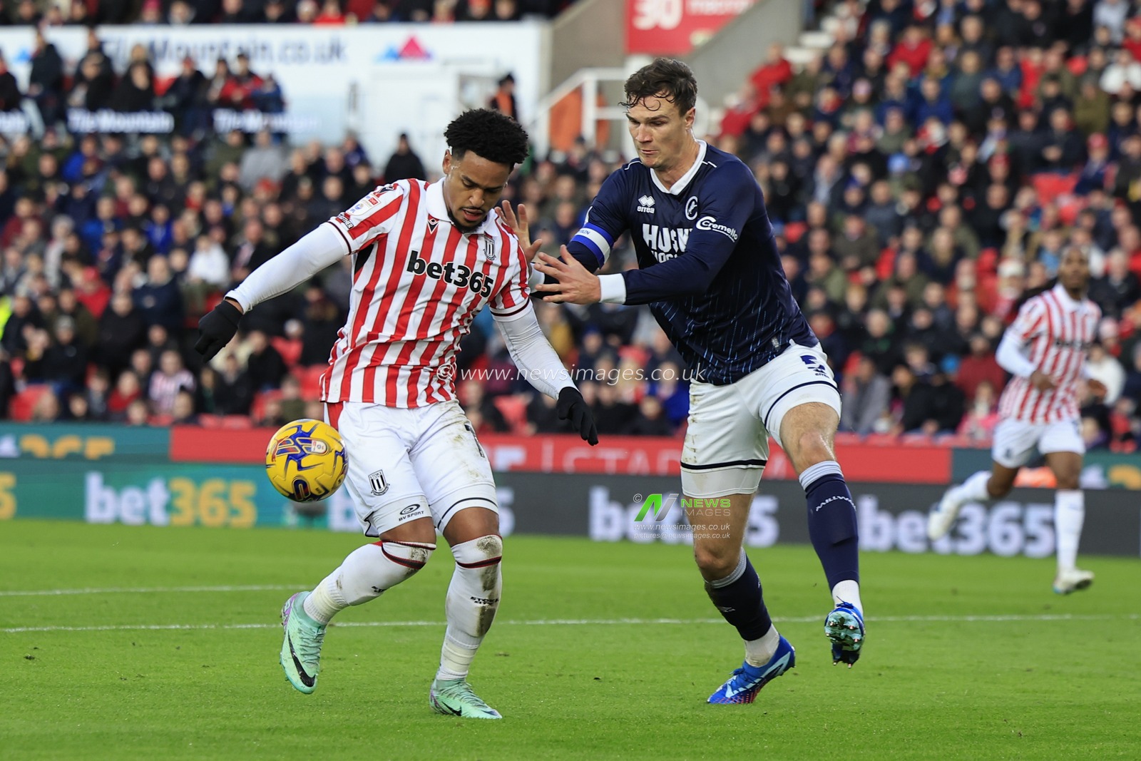 Ryan Mmaee #19 of Stoke City and Jake Cooper #5 of Millwall challenge for the ball during the Sky Bet Championship match Stoke City vs Millwall at Bet365 Stadium, Stoke-on-Trent, United Kingdom, 23rd December 2023

(Photo by Conor Molloy/News Images)