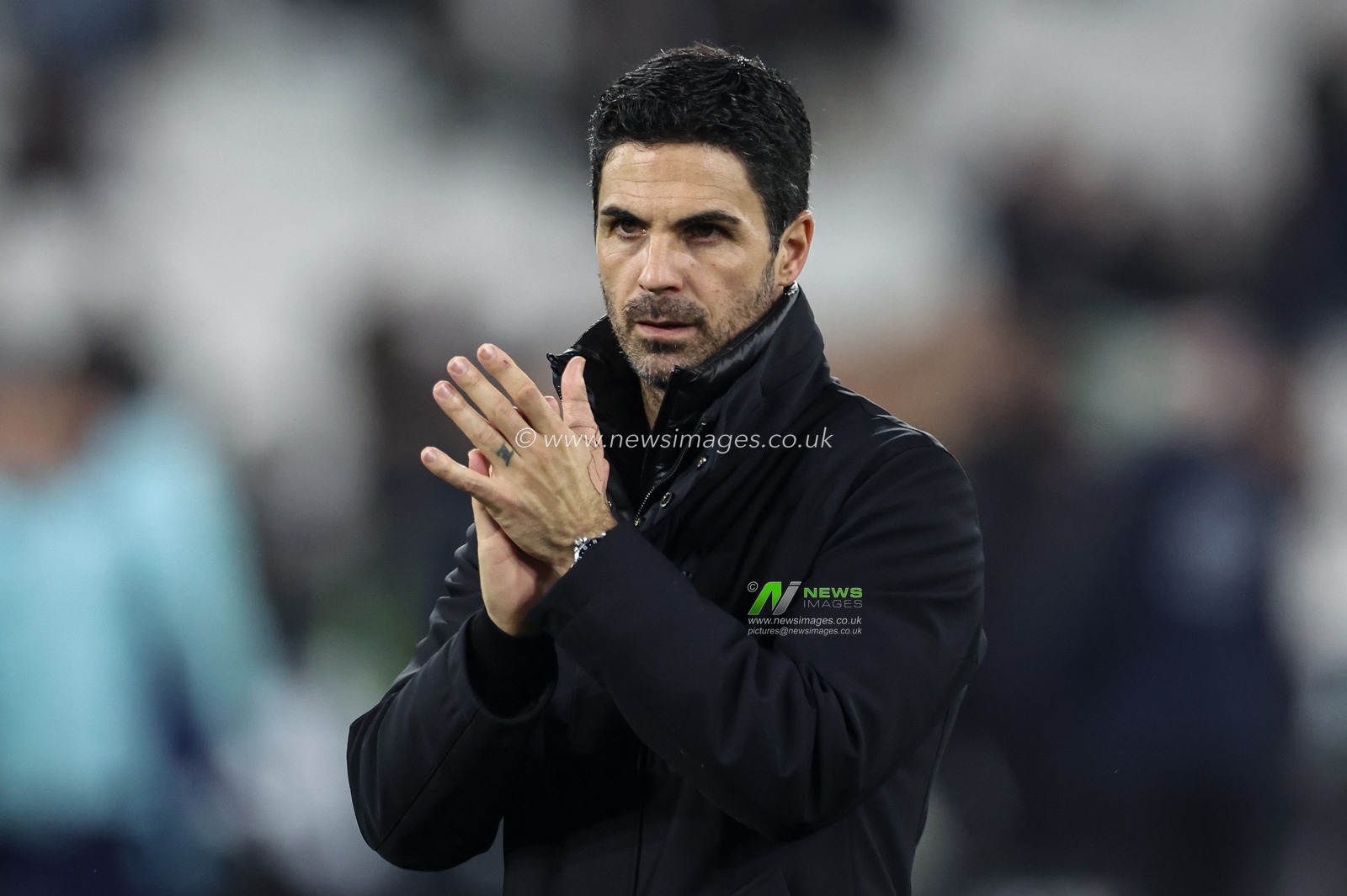 Mikel Arteta manager of Arsenal applauds the fans after the final whistle during the Premier League match West Ham United vs Arsenal at London Stadium, London, United Kingdom, 30th November 2024

(Photo by Mark Cosgrove/News Images)