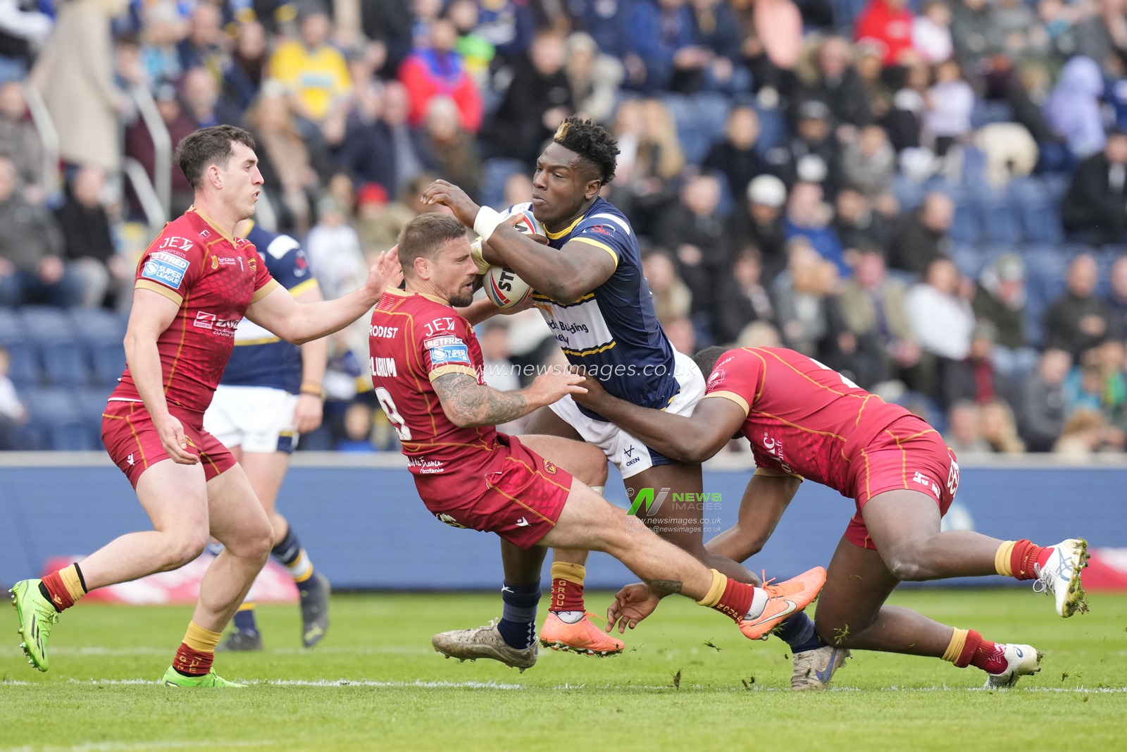 Justin Sangare #17 of Leeds Rhinos drives into Michael McIlorum #9 of Catalans Dragons during the Betfred Super League Round 6 match Leeds Rhinos vs Catalans Dragons at Headingley Stadium, Leeds, United Kingdom, 25th March 2023

(Photo by Steve Flynn/News Images)