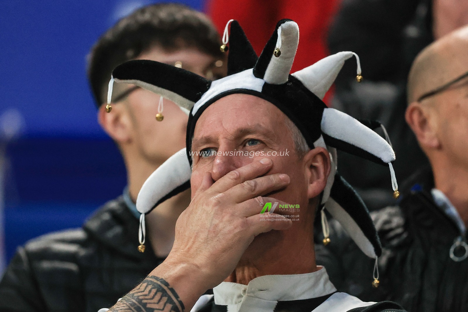 A Newcastle fans holds his head as Newcastle trail Leicester. 3-0