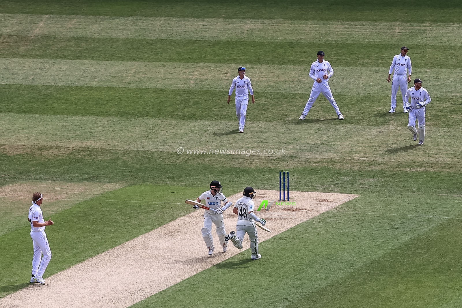 Kane Williamson of New Zealand (L) makes one run