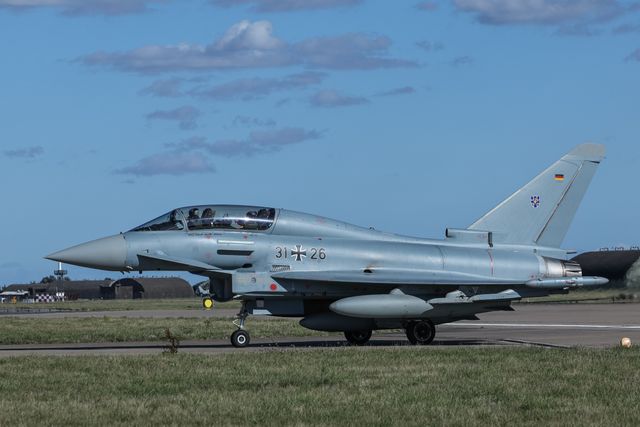 A German Air Force Eurofighter Typhoon FGR Mk4 pilot and engineer wave as it taxies back to the pan during a flight training day at RAF Coningsby, Coningsby, United Kingdom, 22nd September 2025

(Photo by Mark Cosgrove/News Images)