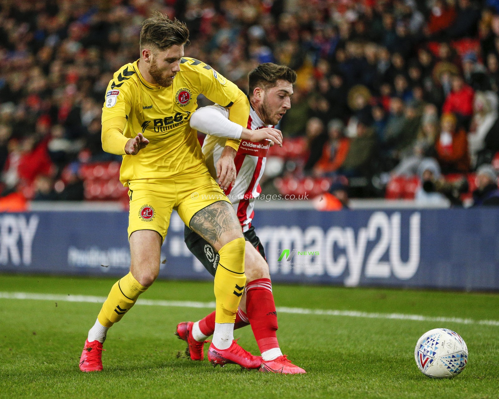 25th February 2020, Stadium Of Light, Sunderland, England; Sky Bet League 1, Sunderland v Fleetwood Town : Lewis Coyle (2) of Fleetwood Town wrestles with Lynden Gooch (11) of Sunderland