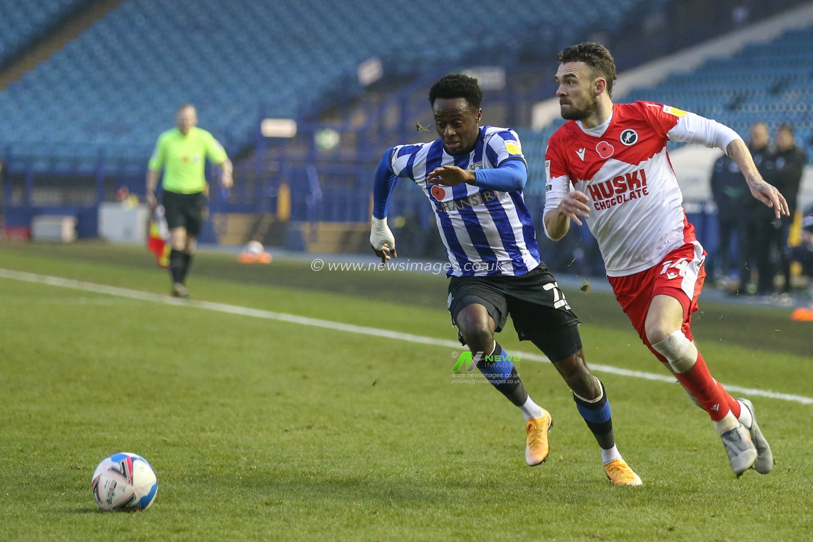 Scott Malone #14 of Millwall battles for possession with Moses Odubajo #22 of Sheffield Wednesday
