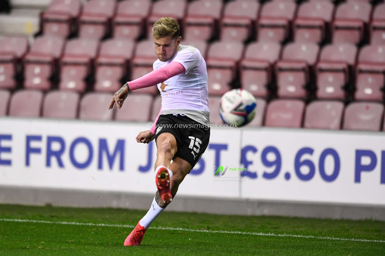 Sammie Szmodics (15) of Peterborough United has a shot at goal during the warm up