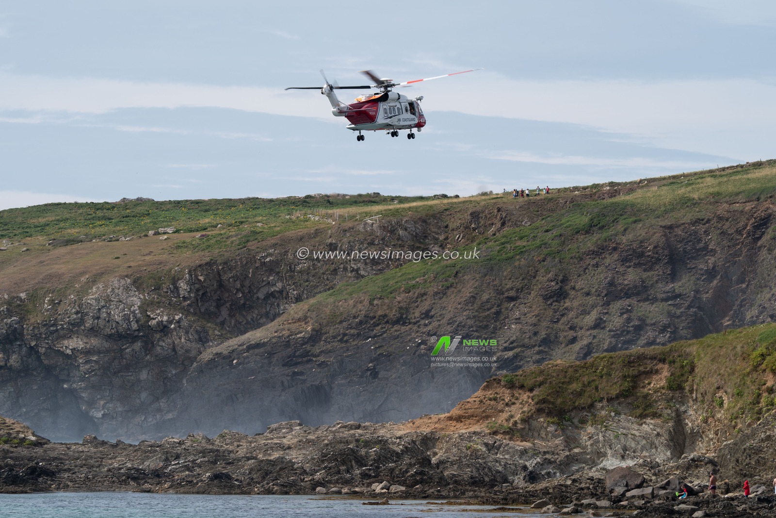 HM Coastguard helicopter is called to assist the local lifeguards and the RNLI on helping a person who had fallen on cliffs near Whitesands Beach, Pembrokeshire.