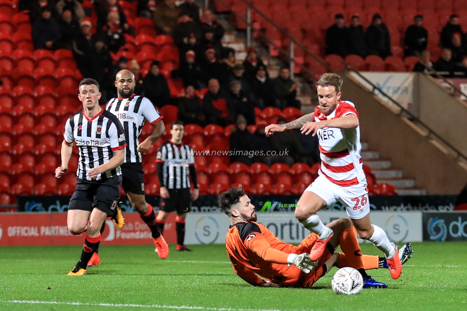 20th November 2018, Keepmoat Stadium, Doncaster, England; The Emirates FA Cup, Round 1, Doncaster Rovers v Chorley ; James Coppinger (26) of Doncaster takes the ball around the keeper

Credit: John Hobson/News Images

English Football League images are subject to DataCo Licence