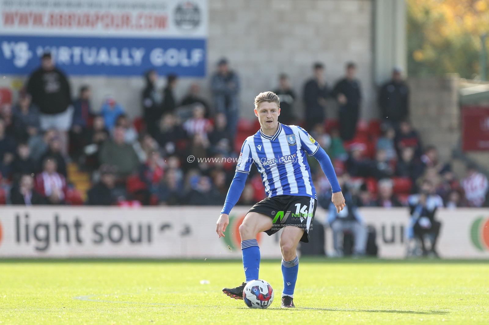 George Byers #14 of Sheffield Wednesday passes the ball during the Sky Bet League 1 match Lincoln City vs Sheffield Wednesday at Gelder Group Sincil Bank Stadium, Lincoln, United Kingdom, 22nd October 2022

(Photo by Arron Gent/News Images)