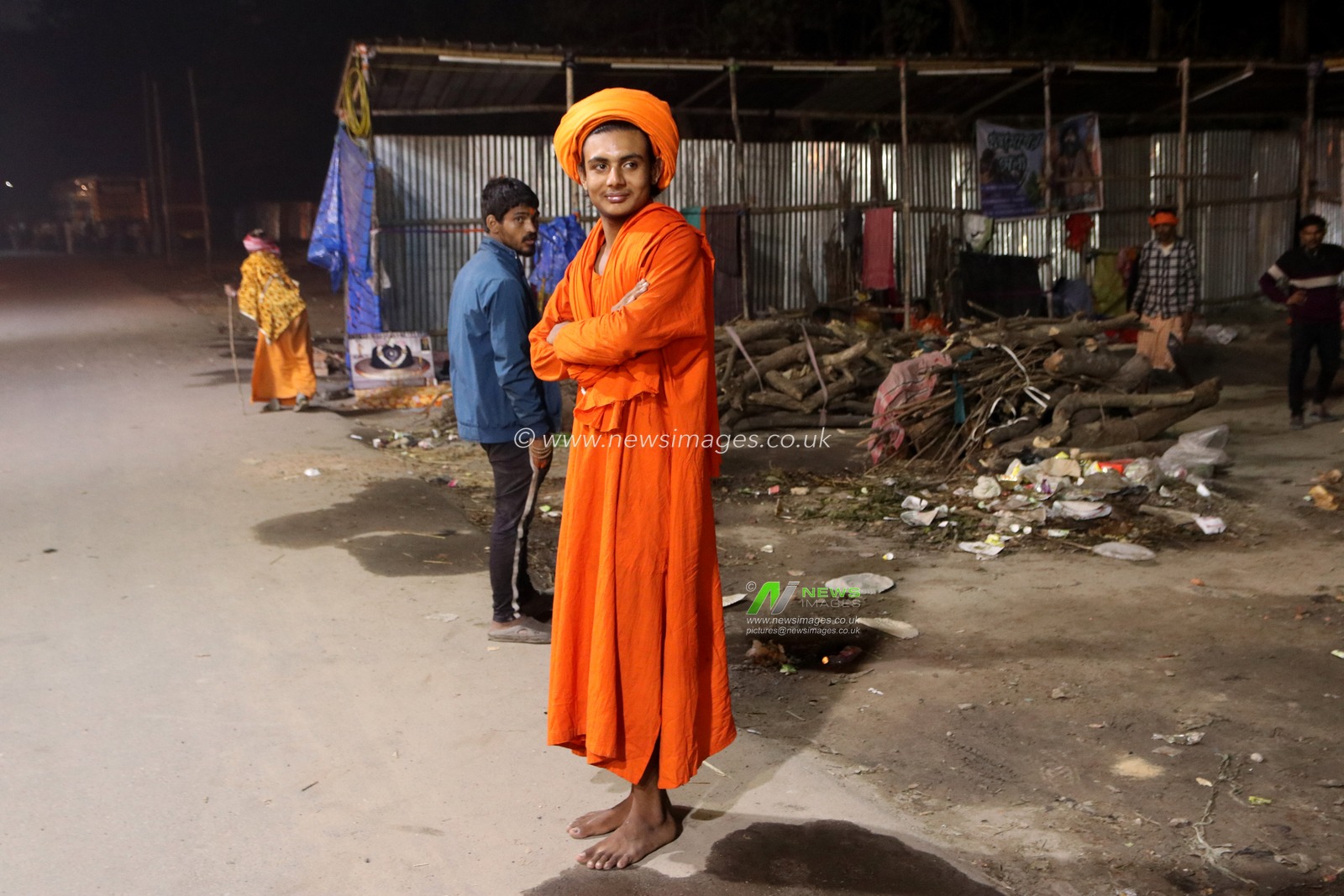A young Sadhu, or Hindu holy man  during the cold winter night in a transit camp on the way to Gangasagar, Kolkata, India on December 30,2024.Pictures by Debajyoti Chakraborty.(Photo: Debajyoti Chakraborty/News Images)