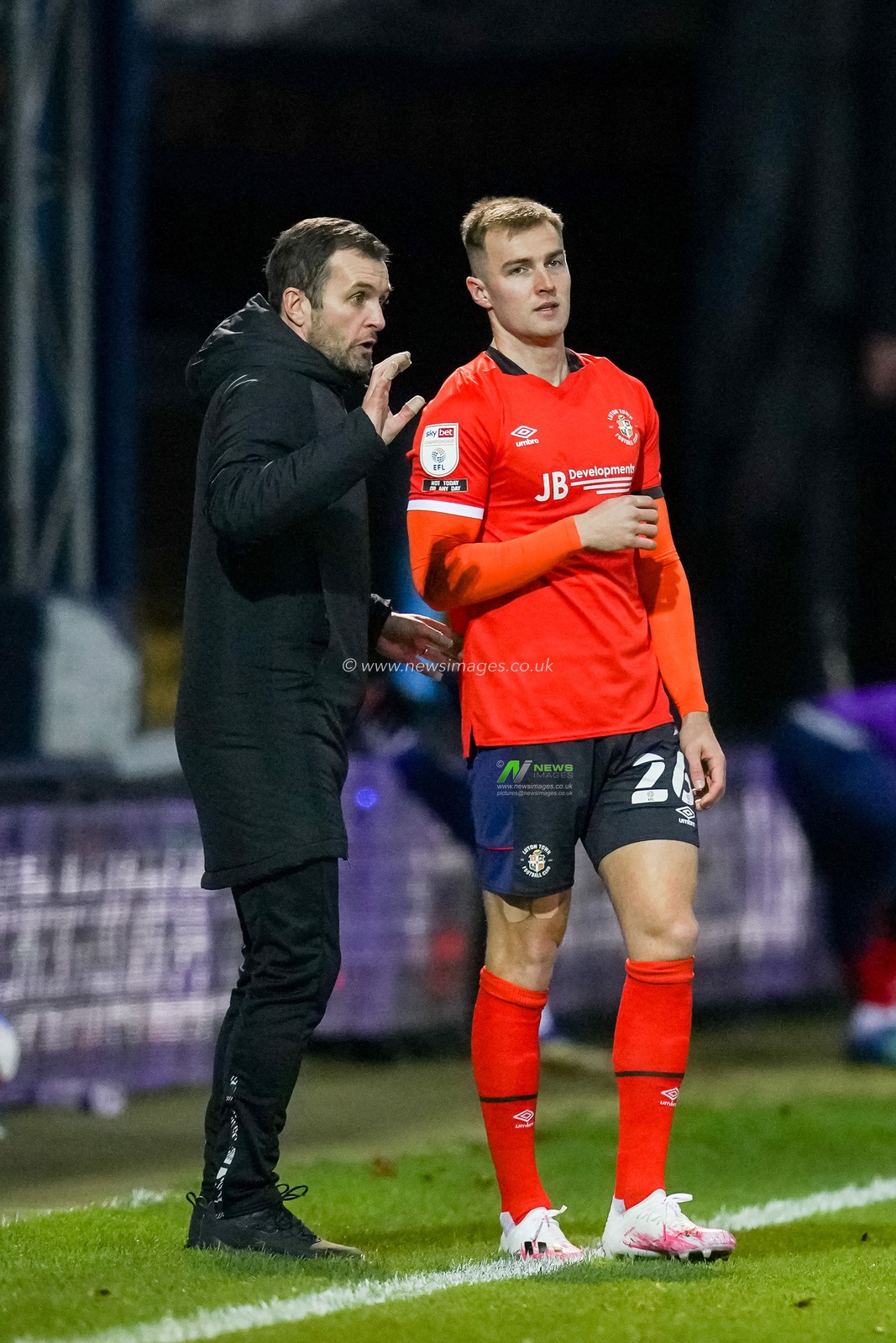 Nathan Jones manager of Luton Town gives a tactic talk to James Bree #26 of Luton Town
