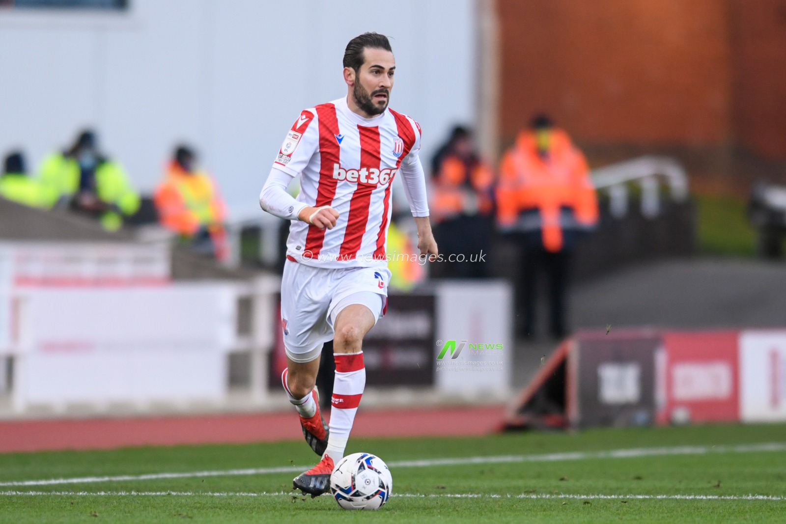 Mario Vrancic #8 of Stoke City runs forward with the ball