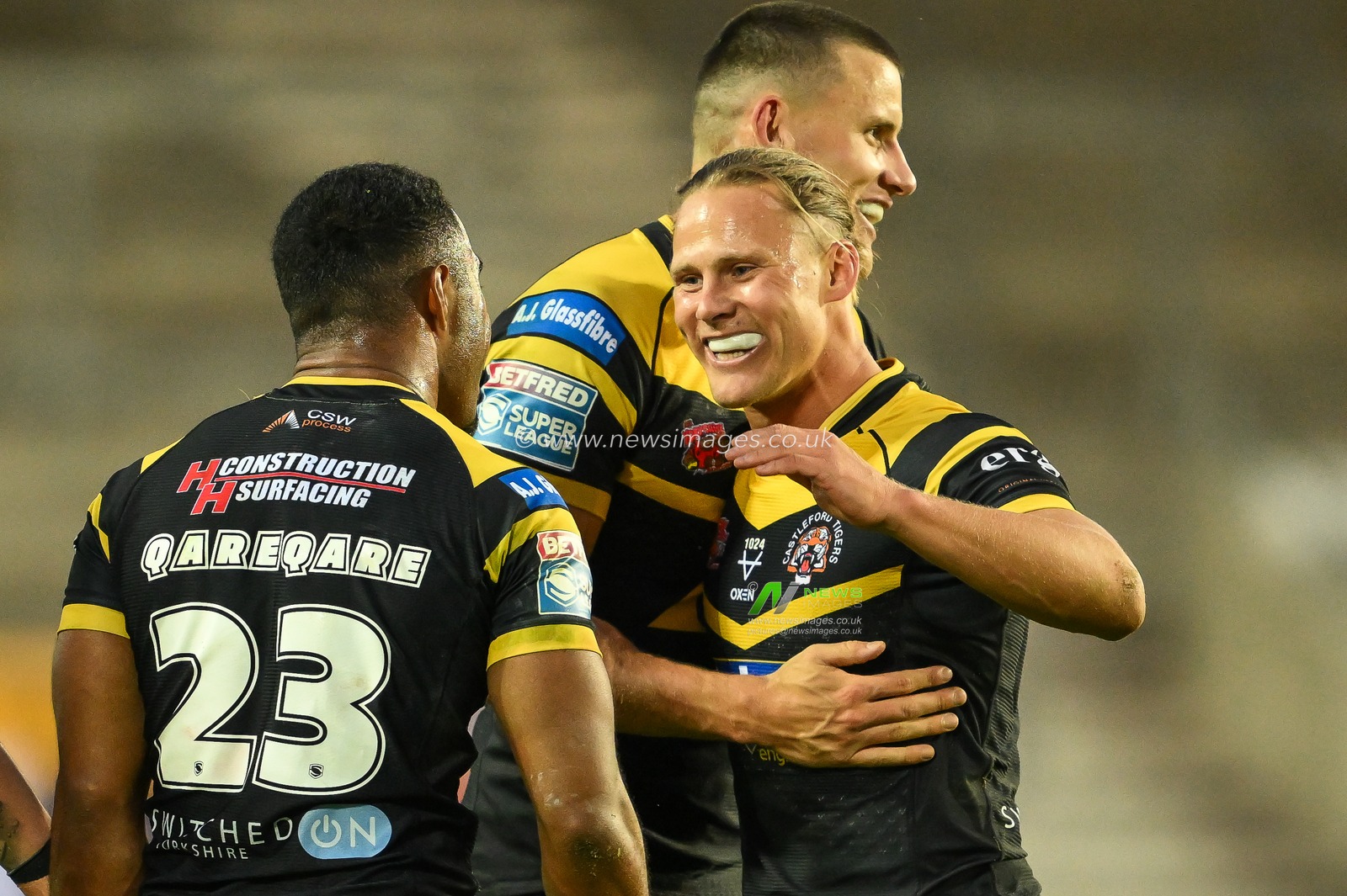 Jason Qareqare of Castleford Tigers and Jacob Miller of Castleford Tigers celebrate a famous win over St. Helens at the end of the Betfred Super League Round 16 match St Helens vs Castleford Tigers at Totally Wicked Stadium, St Helens, United Kingdom, 5th July 2024

(Photo by Craig Thomas/News Images)