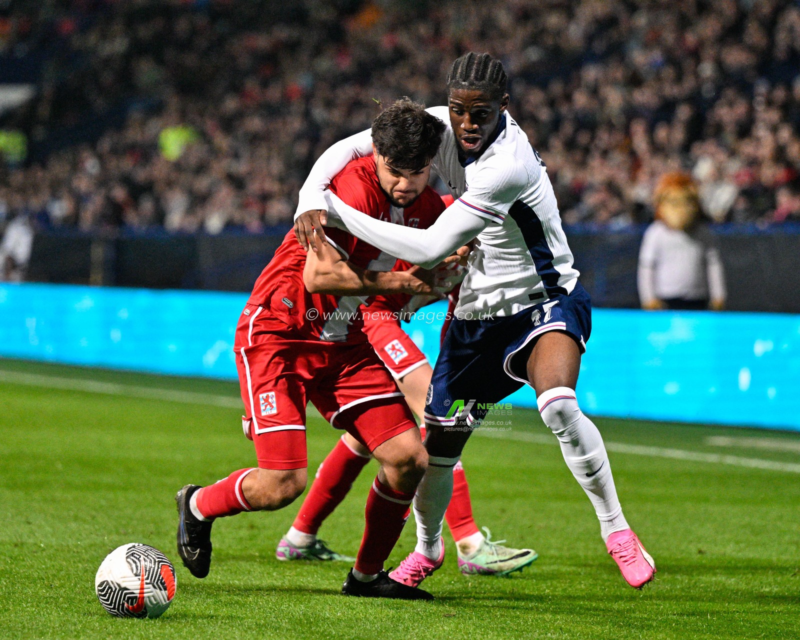 Emre Erkus of Luxembourg and Samuel Iling-Junior of England battle for the ball, during the UEFA Euro U21 Qualifiers Group F match England U21 vs Luxembourg U21 at Toughsheet Community Stadium, Bolton, United Kingdom, 26th March 2024

(Photo by Cody Froggatt/News Images)