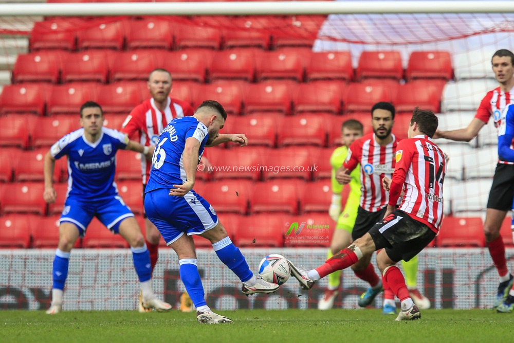 Alex MacDonald #16 of Gillingham shoots at goal and scores to make it 1-1