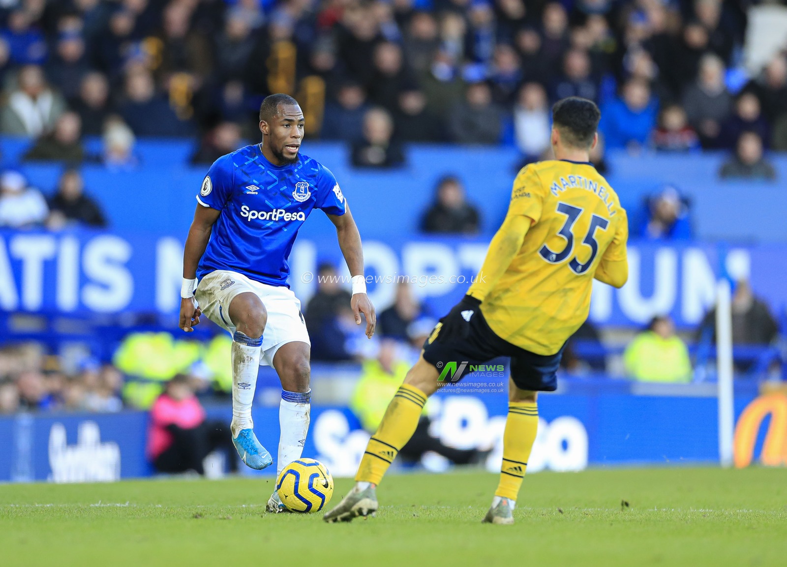 21st December 2019, Goodison Park, Liverpool, England; Premier League, Everton v Arsenal : Djibril Sidibe (19) of Everton is confronted by Gabriel Martinelli (35) of Arsenal

Credit: Conor Molloy/News Images