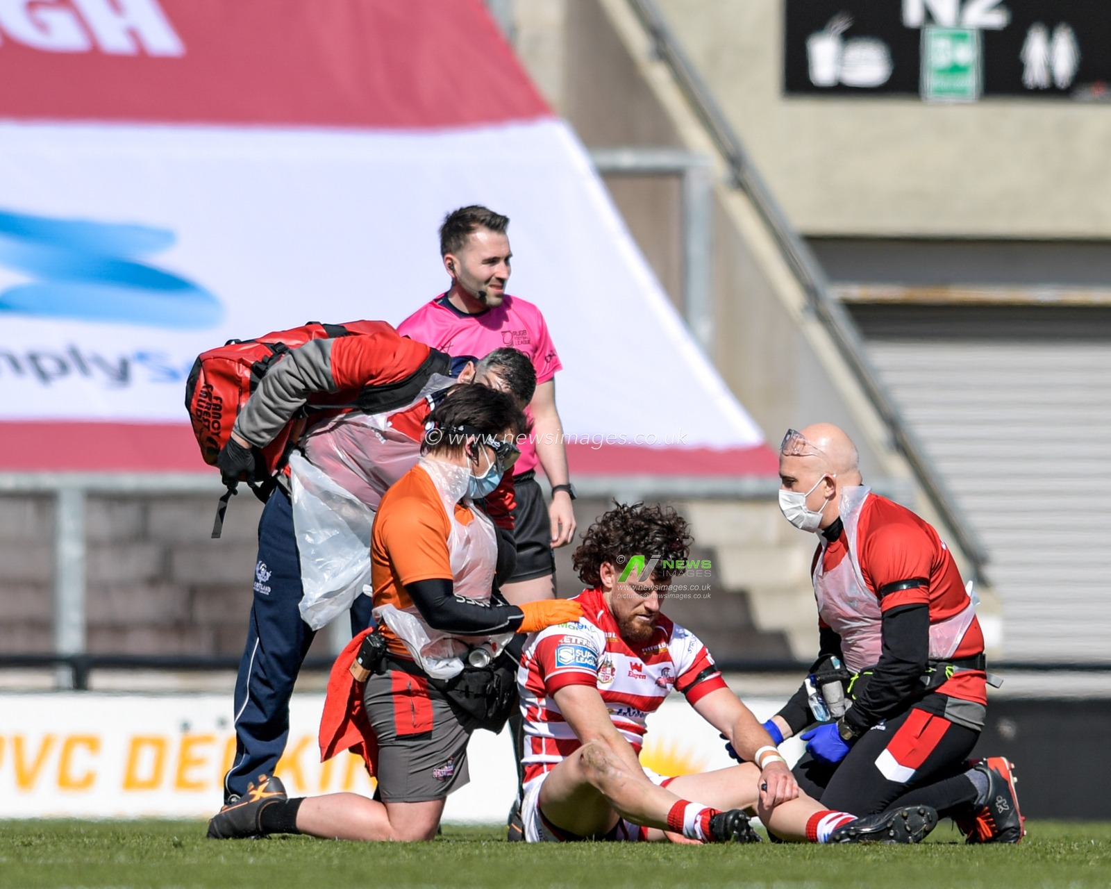 Blake Wallace (6) of Leigh Centurions receives treatment on the pitch after an injury