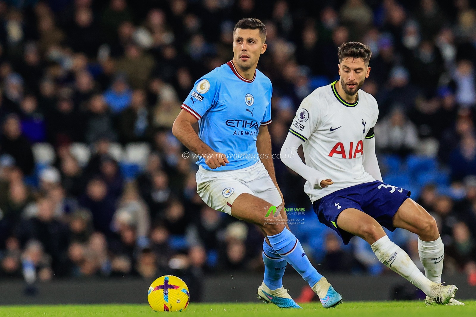 Rodri #16 of Manchester City holds the ball as Rodrigo Bentancur #30 of Tottenham Hotspur tracks him during the Premier League match Manchester City vs Tottenham Hotspur at Etihad Stadium, Manchester, United Kingdom, 19th January 2023

(Photo by Conor Molloy/News Images)
