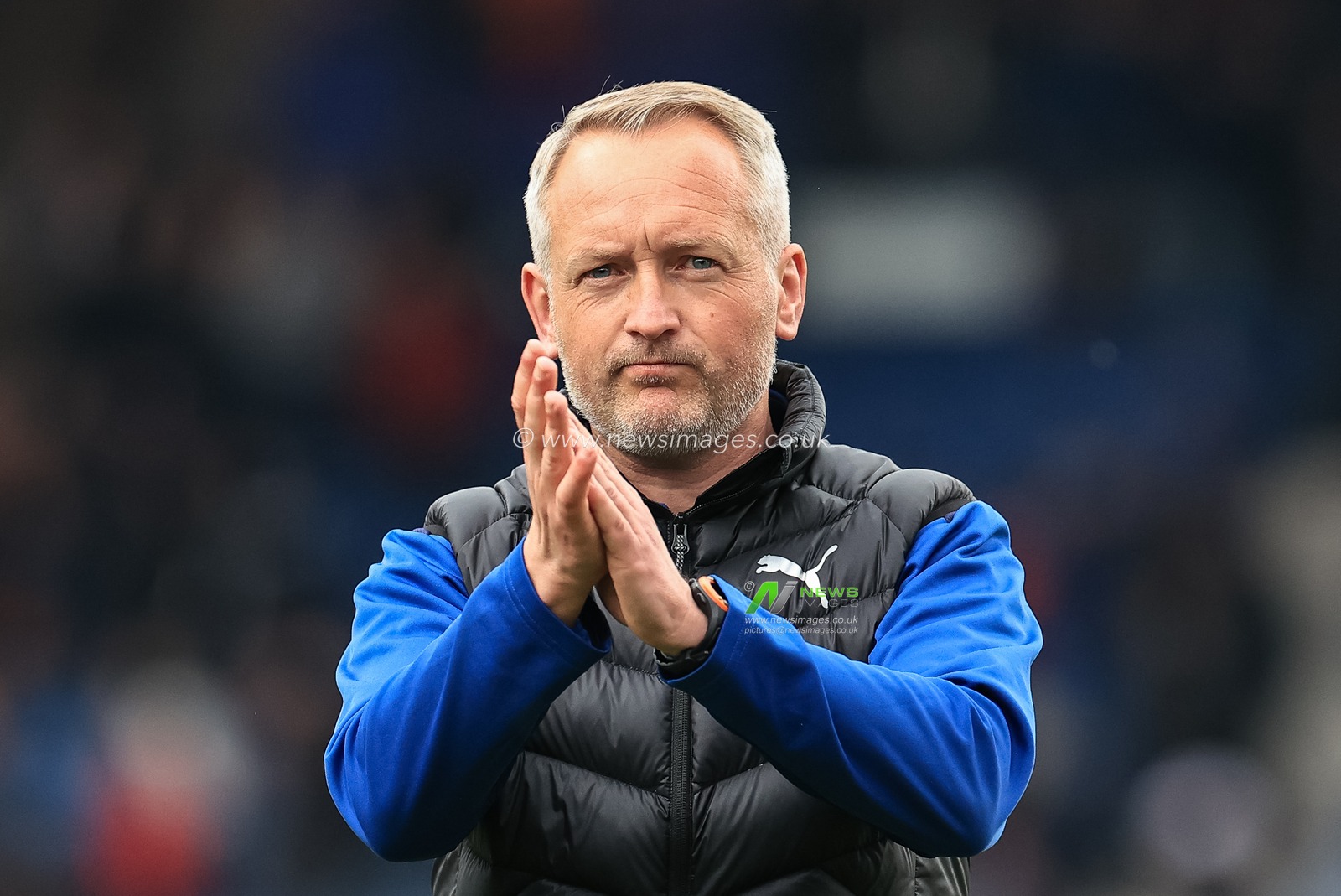 Neil Critchley head coach of Blackpool applauds the traveling fans after Blackpool draw 1-1