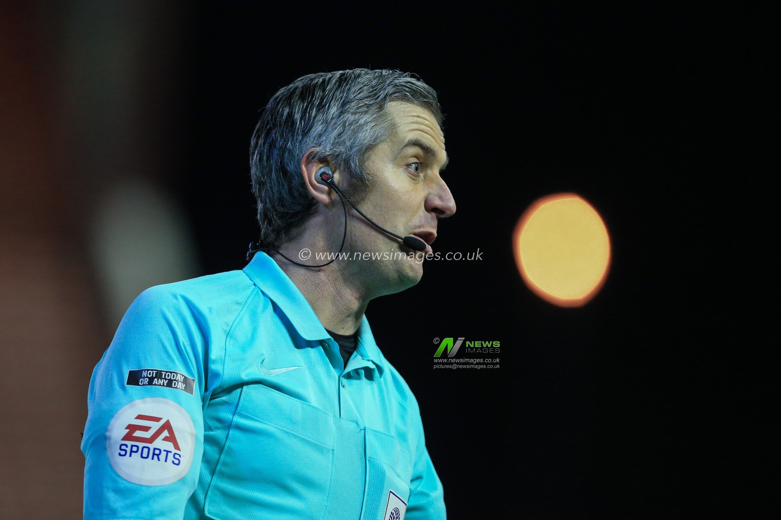 Referee Darren Bond during the game