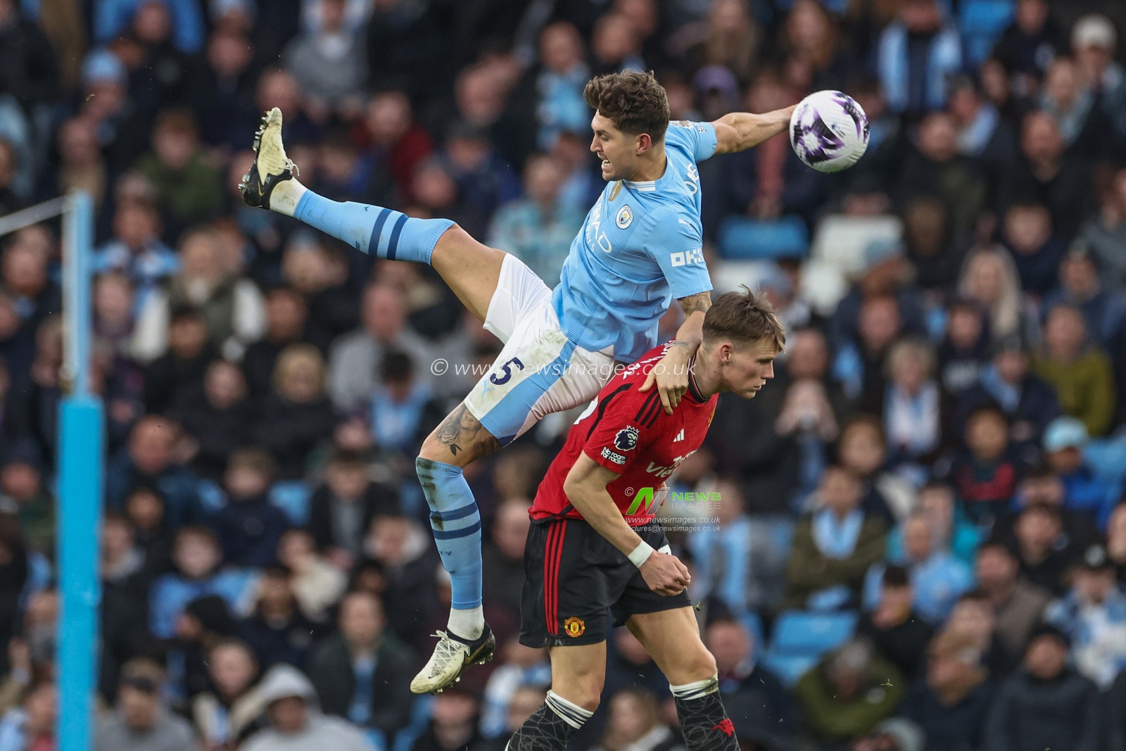Scott McTominay of Manchester United fouls John Stones of Manchester City during the Premier League match Manchester City vs Manchester United at Etihad Stadium, Manchester, United Kingdom, 3rd March 2024

(Photo by Mark Cosgrove/News Images)