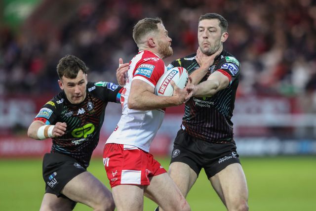 Jake Wardle of Wigan Warriors challenges Joe Burgess of Hull KR during the Betfred Super League Round 9 match Hull KR vs Wigan Warriors at Sewell Group Craven Park, Kingston upon Hull, United Kingdom, 26th April 2024

(Photo by Alfie Cosgrove/News Images)