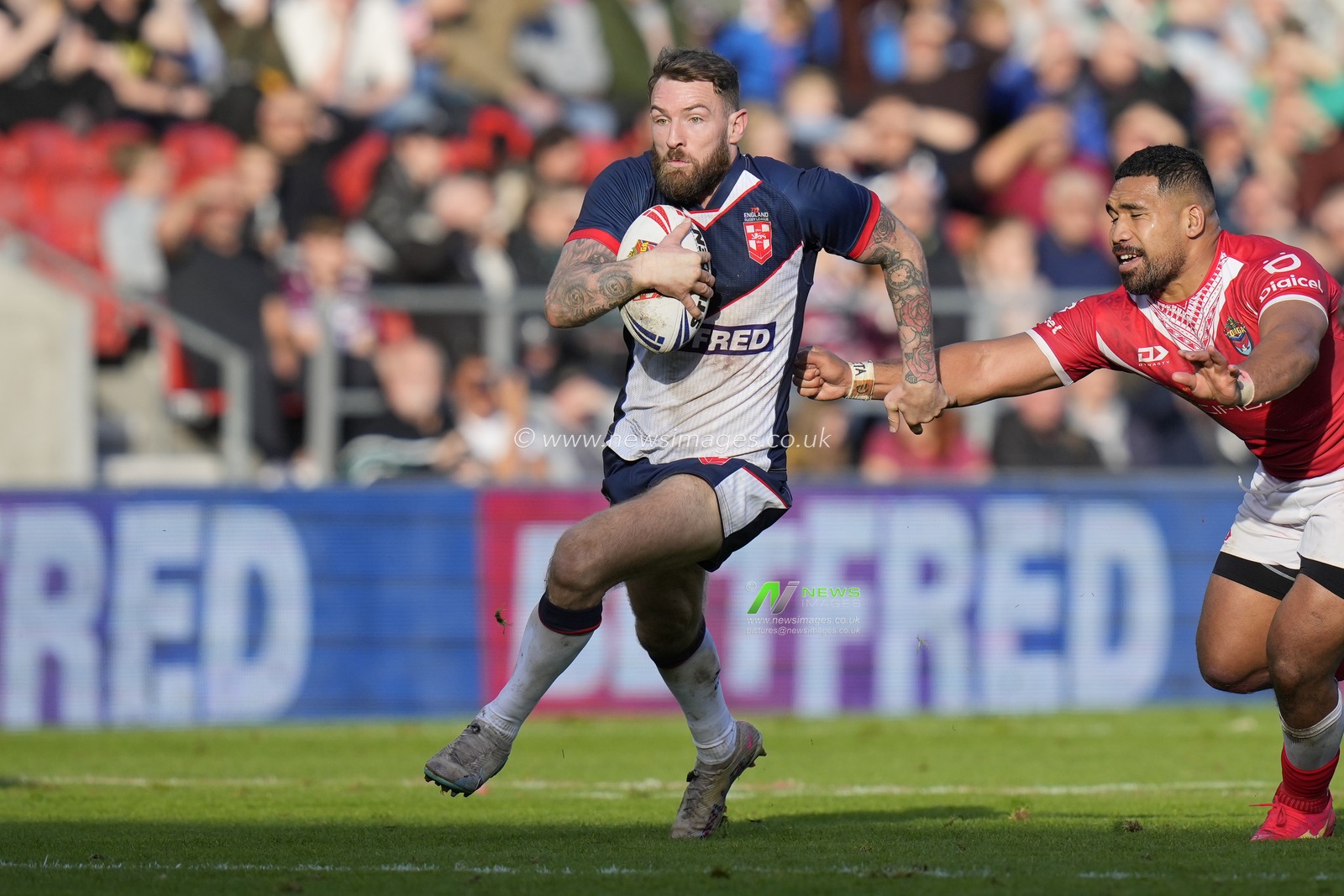 Daryl Clark #9 of England makes a break during the Rugby League International match England vs Tonga at Totally Wicked Stadium, St Helens, United Kingdom, 22nd October 2023

(Photo by Steve Flynn/News Images)