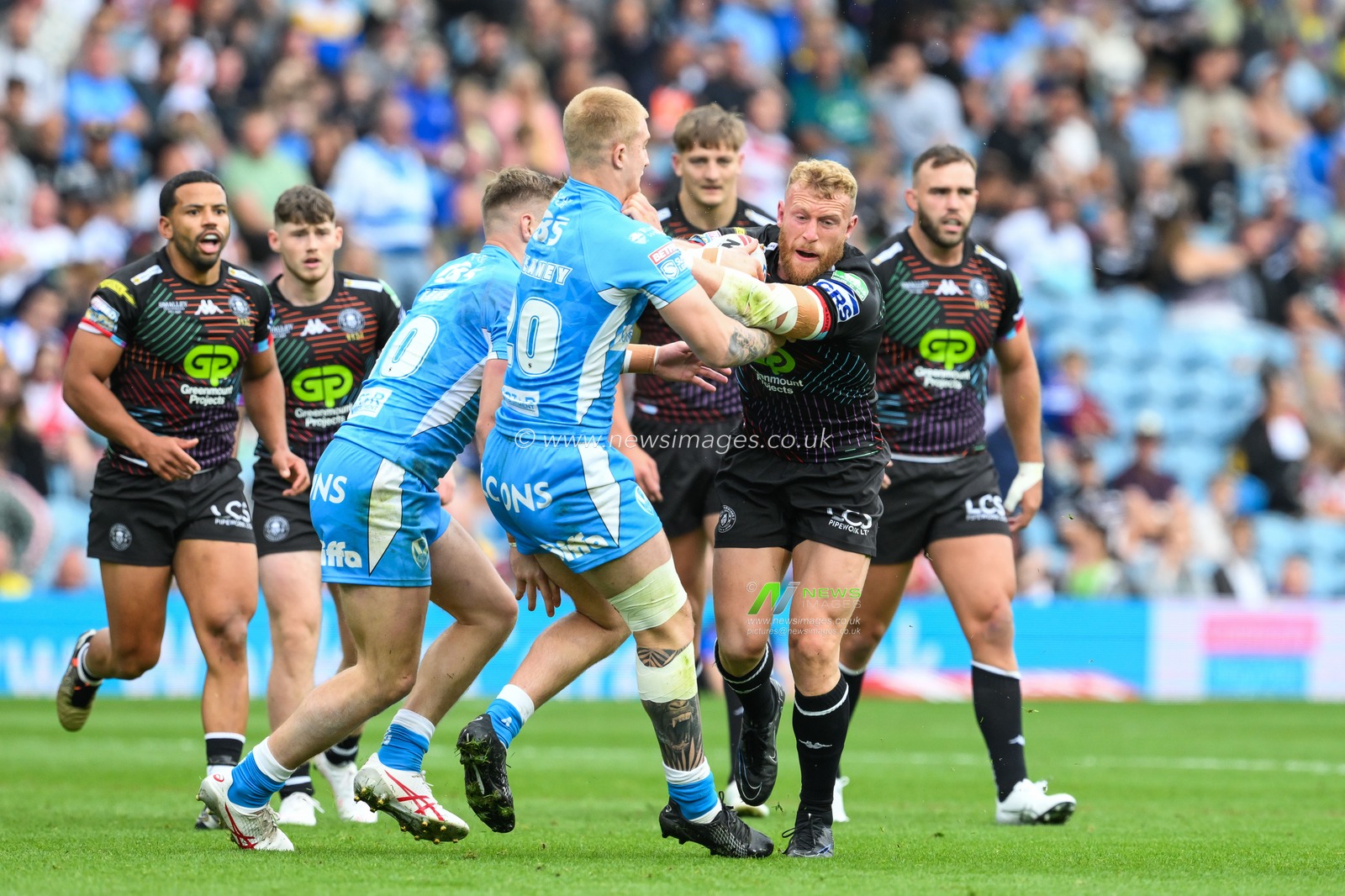 Luke Thompson of Wigan Warriors fends off George Delaney of St. Helens during the Magic Weekend match Wigan Warriors vs St Helens at Elland Road, Leeds, United Kingdom, 17th August 2024

(Photo by Craig Thomas/News Images)