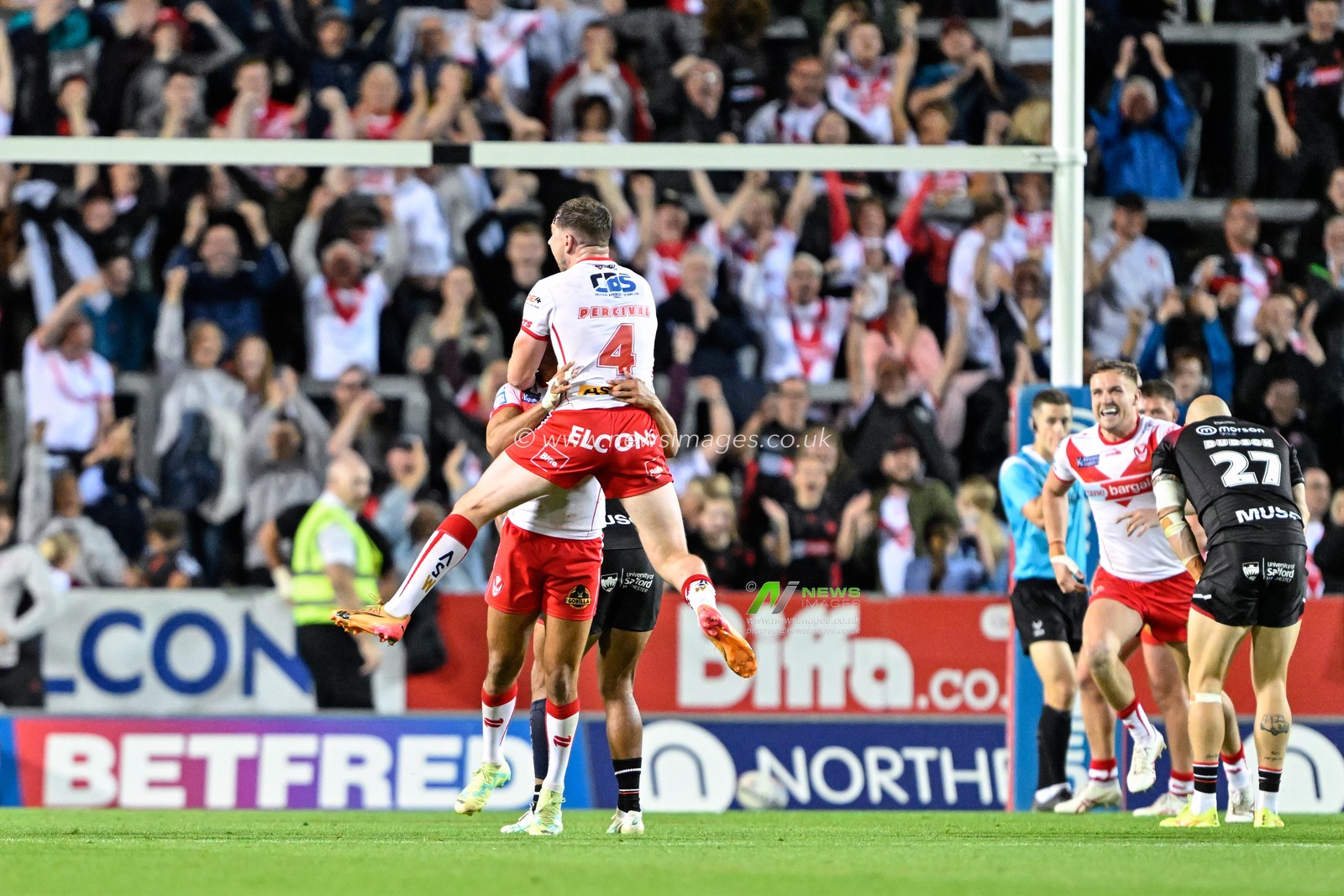 St Helens celebrates Moses Mbye of St. Helens drop goal to make it 17-16 St Helens during the Betfred Super League Round 21 match St Helens vs Salford Red Devils at Totally Wicked Stadium, St Helens, United Kingdom, 8th August 2024

(Photo by Cody Froggatt/News Images)