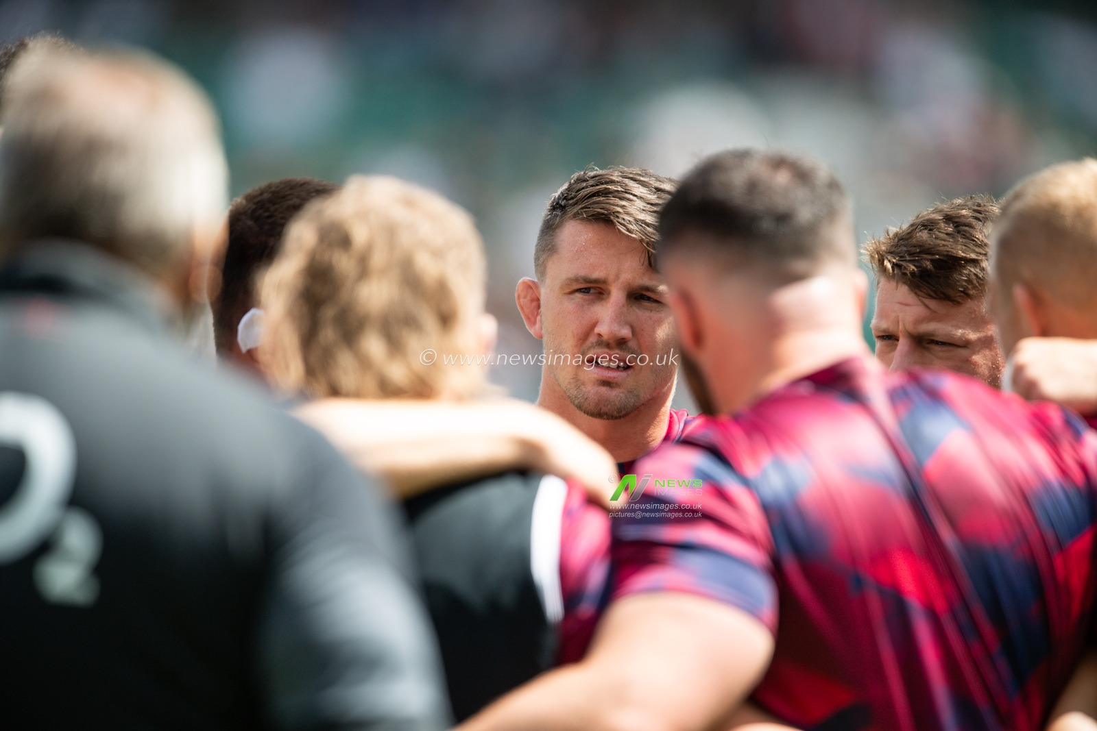 Tom Curry of England in a team huddle during pre match warm up