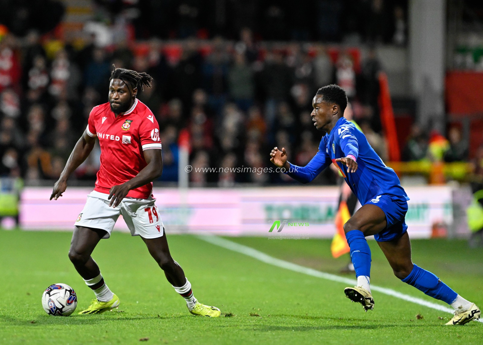 Jacob Mendy of Wrexham in action, during the Sky Bet League 2 match Wrexham vs Harrogate Town at SToK Cae Ras, Wrexham, United Kingdom, 12th March 2024

(Photo by Cody Froggatt/News Images)