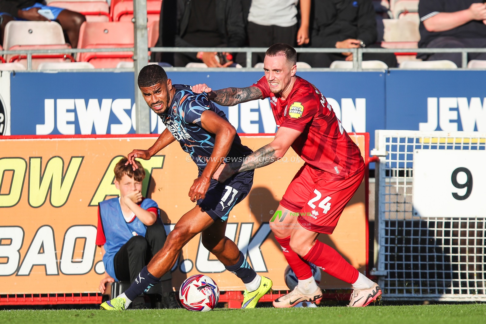 Ashley Fletcher of Blackpool is fouled by Toby Mullarkey of Crawley Town during the Sky Bet League 1 match Crawley Town vs Blackpool at Broadfield Stadium, Crawley, United Kingdom, 10th August 2024

(Photo by Gareth Evans/News Images)