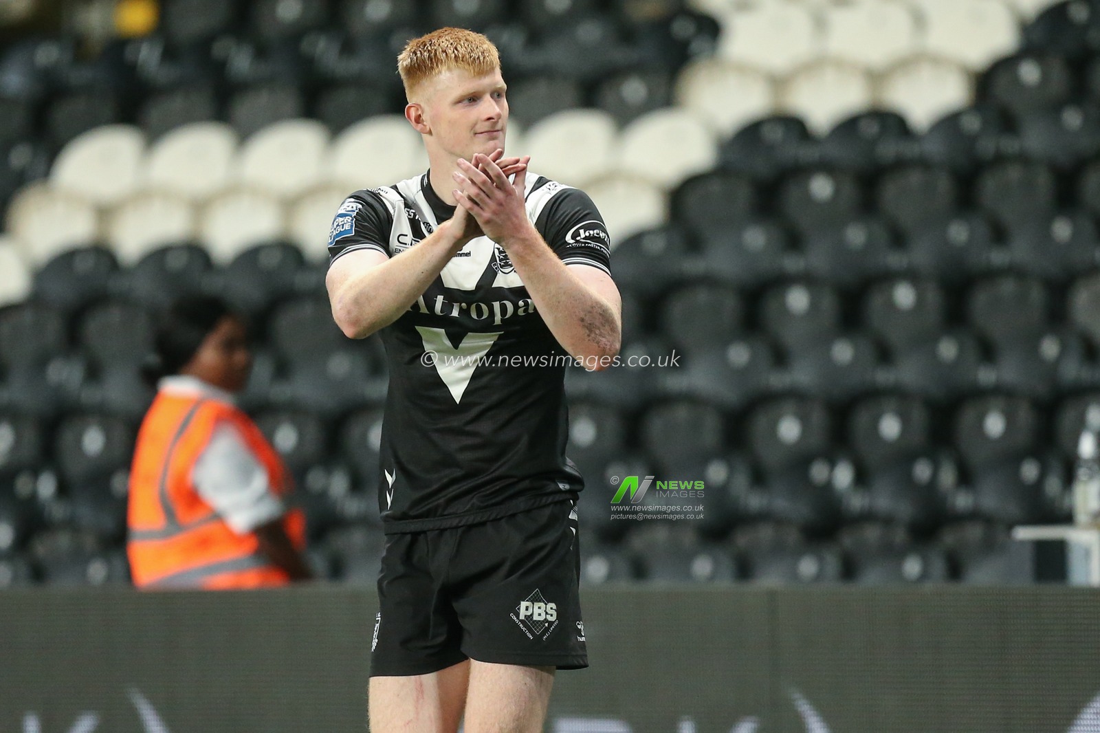 Harvey Barron #32 of Hull FC applauds the remaining fans after the final whistle