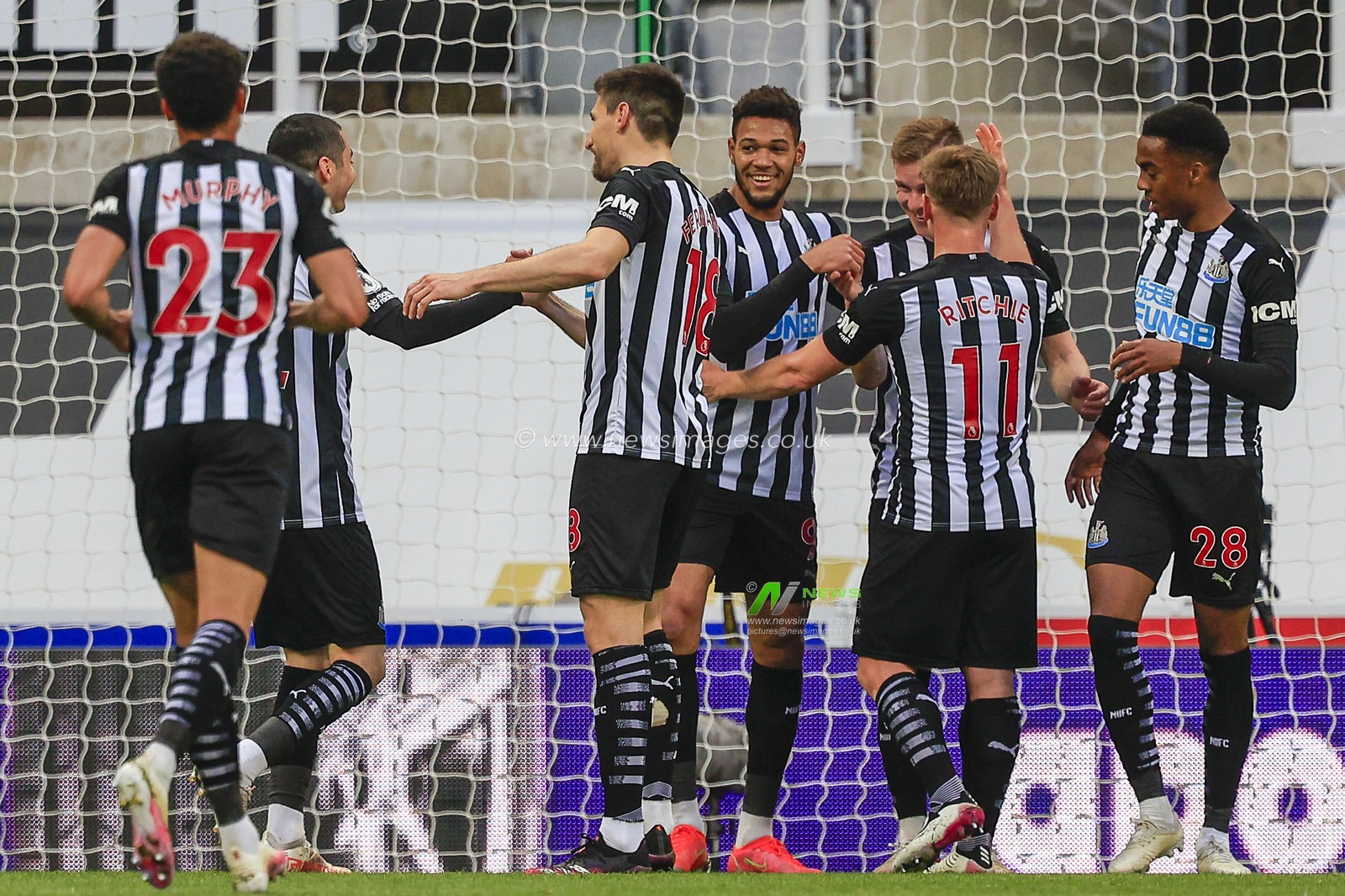 Emil Krafth #17 of Newcastle United celebrates his goal with his teammates to make it 1-0