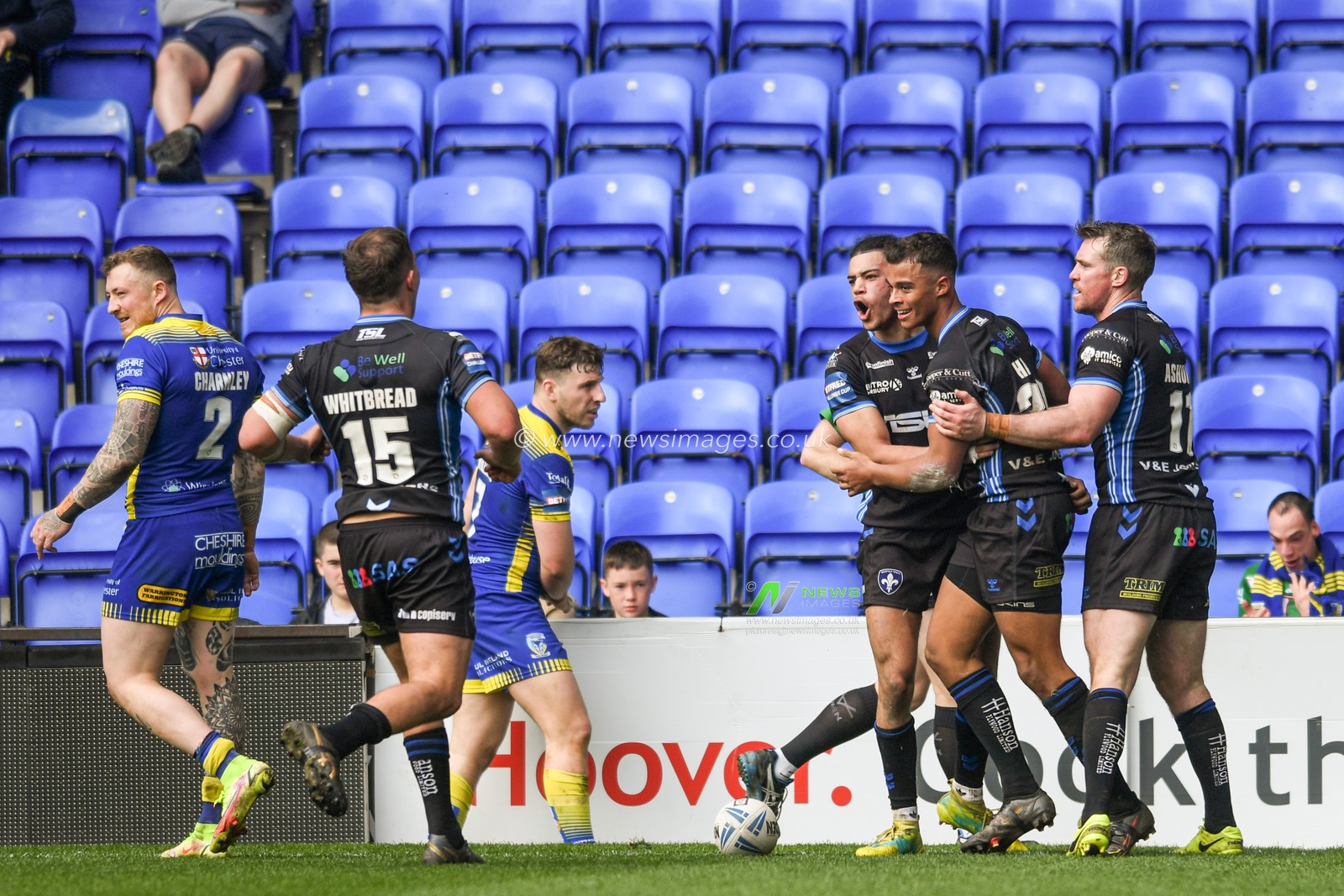 Corey Hall #30 of Wakefield Trinity celebrates scoring a try to make it 12-16