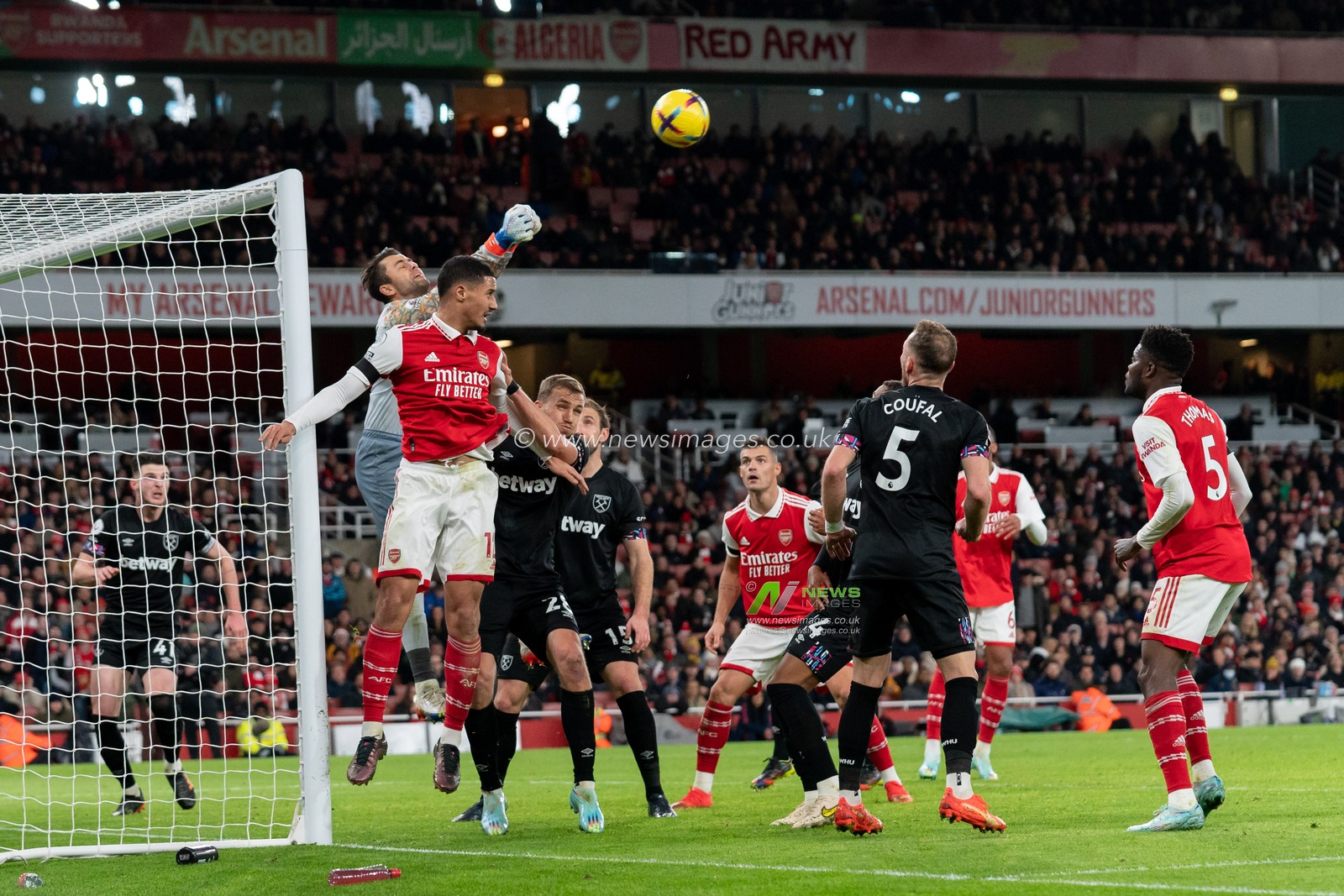 Lukasz Fabianski #1 of West Ham United punches the ball clear from William Saliba #12 of Arsenal during the Premier League match Arsenal vs West Ham United at Emirates Stadium, London, United Kingdom, 26th December 2022

(Photo by Richard Washbrooke/News Images)